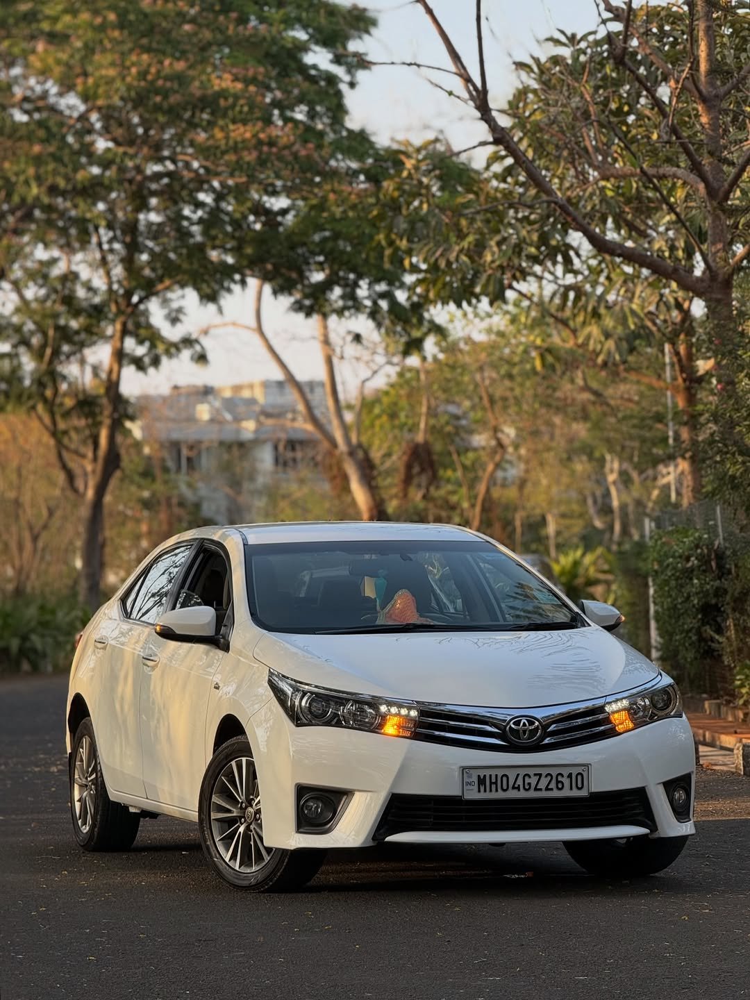 Photo by Glam Carzz on April 07, 2026. May be an image of wheel, sedan, road and text that says 'ቀወው -MH04GZ2610'.