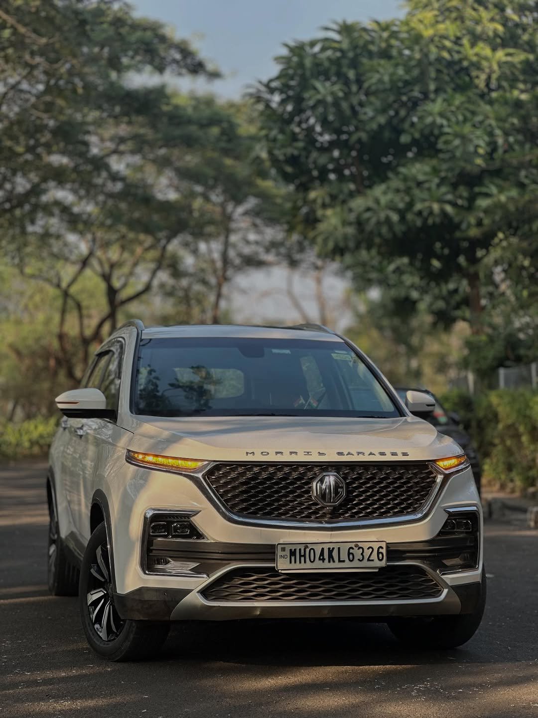 Photo by Glam Carzz on December 25, 2025. May be an image of sedan, wheel, road and text that says 'MOR科工 BARASES ብጣ MH04KL6326'.