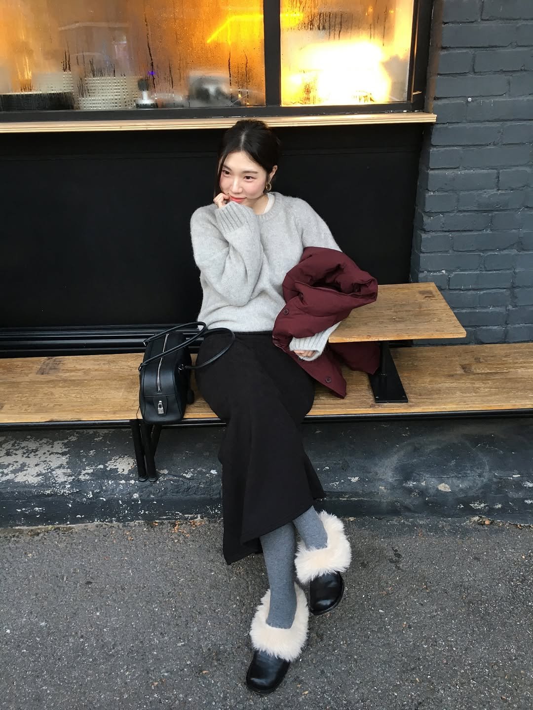 Photo shared by 곰송이 Songyi Moon on December 15, 2025 tagging @evesage_official. May be an image of duffle coat, overcoat, fur, parka, cardigan, boots, turtleneck and text.