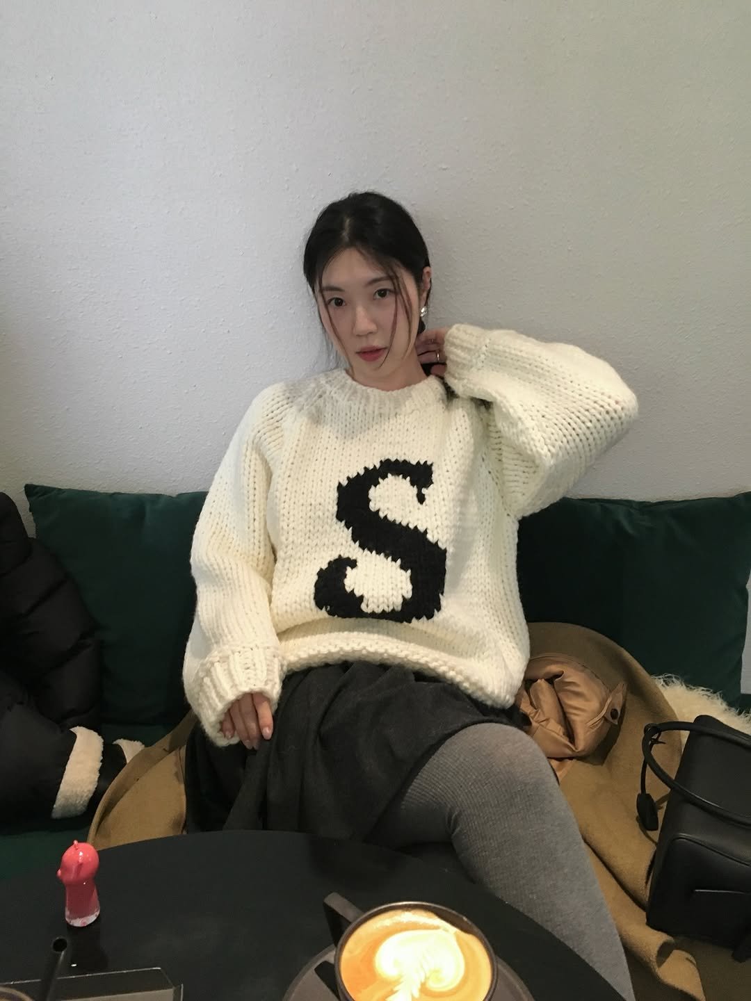 Photo shared by 곰송이 Songyi Moon on December 25, 2025 tagging @somewherebutter. May be an image of coffee, sweater, knit, turtleneck, fleece, top and text.
