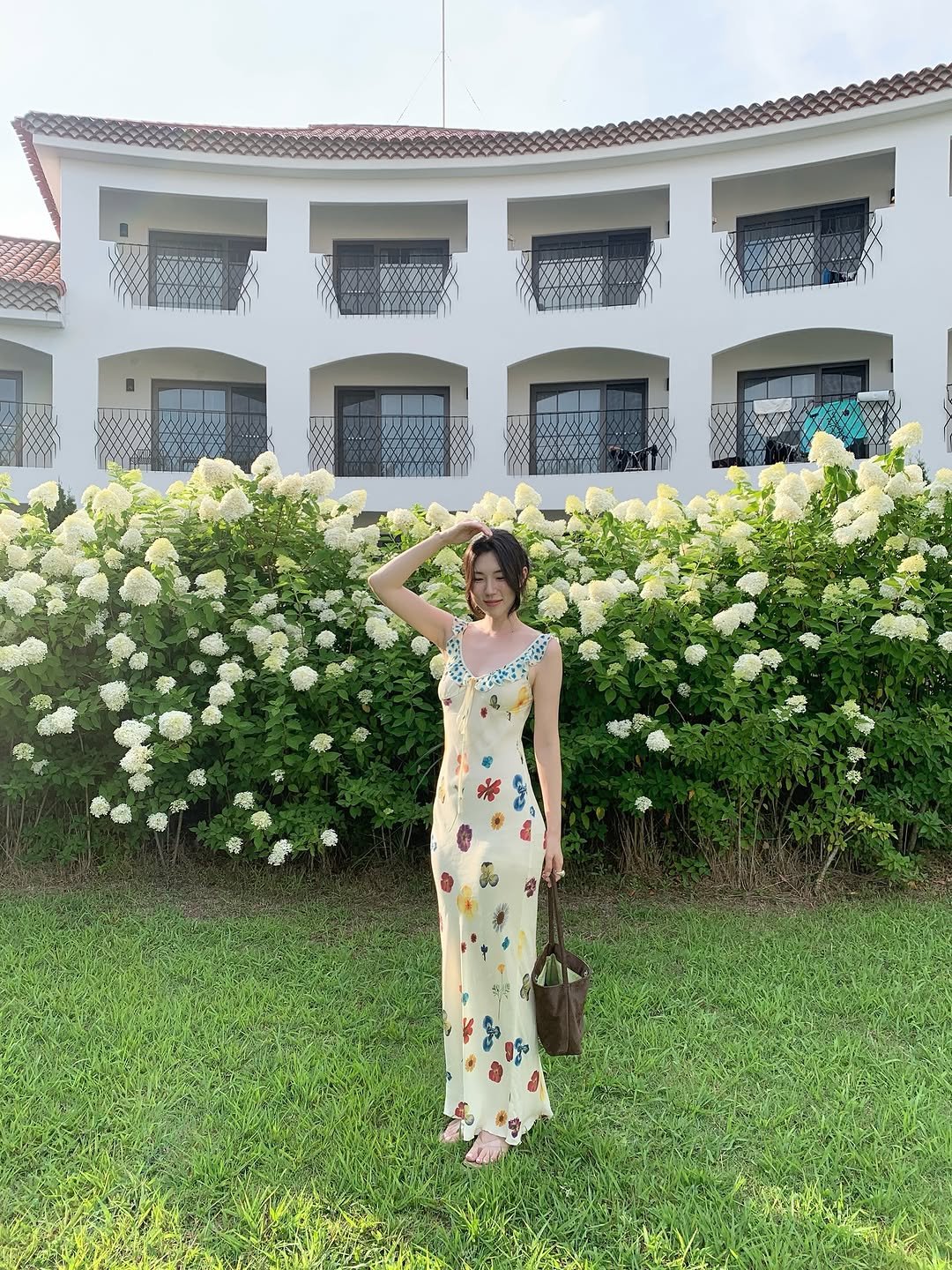 Photo shared by 곰송이 Songyi Moon on August 04, 2025 tagging @nieh.kr. May be an image of 1 person, sarong, dress, sundress, flower and text.