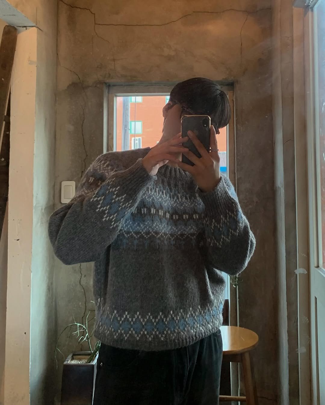 Photo shared by Good Look 굿룩 on December 05, 2025 tagging @t.o_y.o. May be an image of sweater, knit, fleece, mirror, turtleneck, cardigan and text.