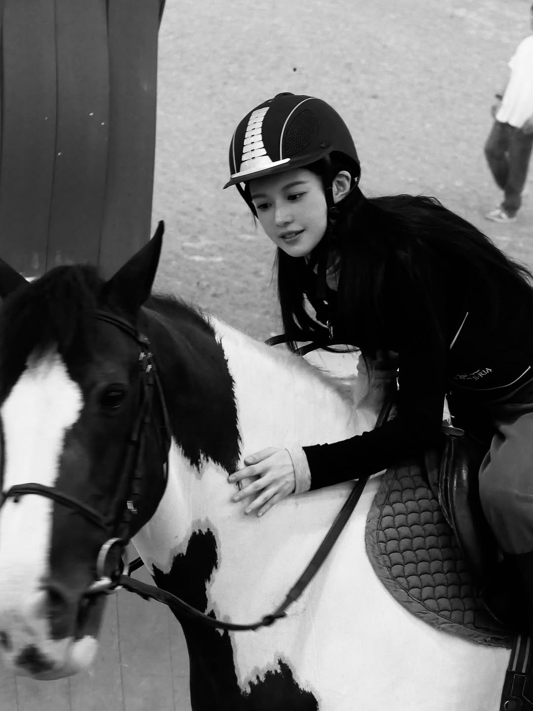 Photo shared by 고윤정 on September 05, 2025 tagging @marithe_kr. May be a black-and-white image of 2 people, horse and pants.