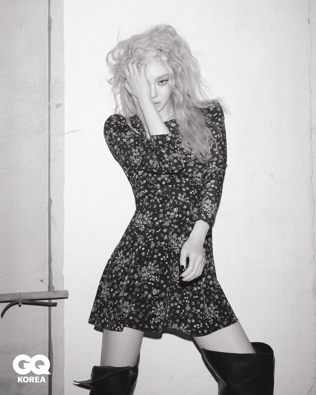 Photo shared by GQ KOREA on April 16, 2026 tagging @gucci, and @imnotningning. May be a black-and-white image of one or more people, blonde hair, boots, dress, fishnet stockings, miniskirt and text.