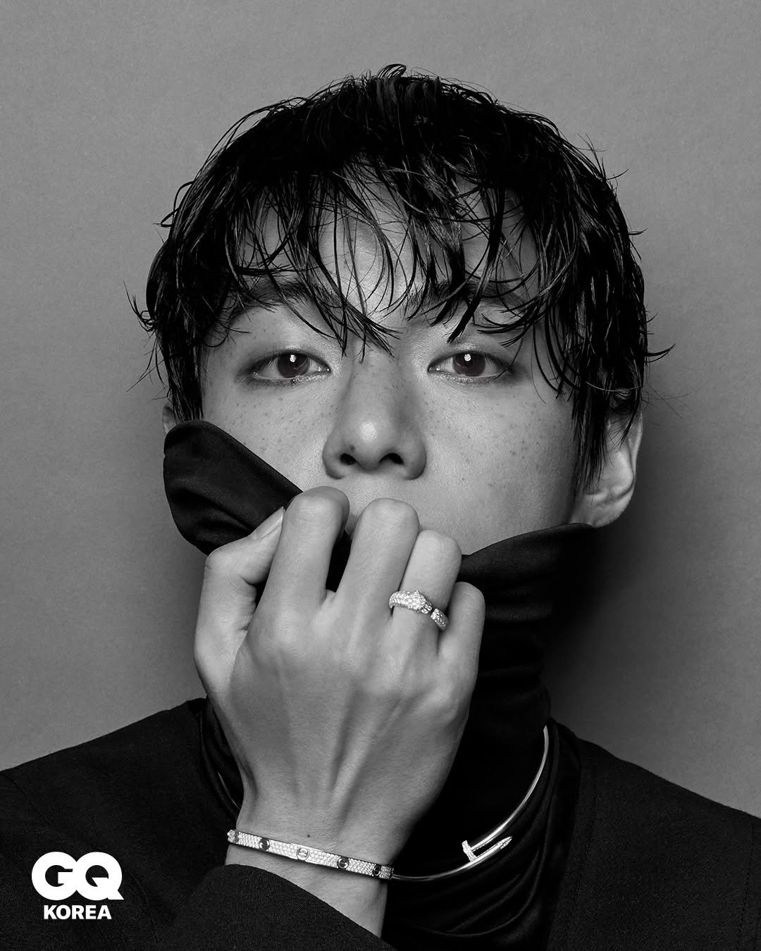 Photo shared by GQ KOREA on January 15, 2026 tagging @cartier, and @thv. May be a black-and-white image of one or more people, bangs, top, bolo tie and text.