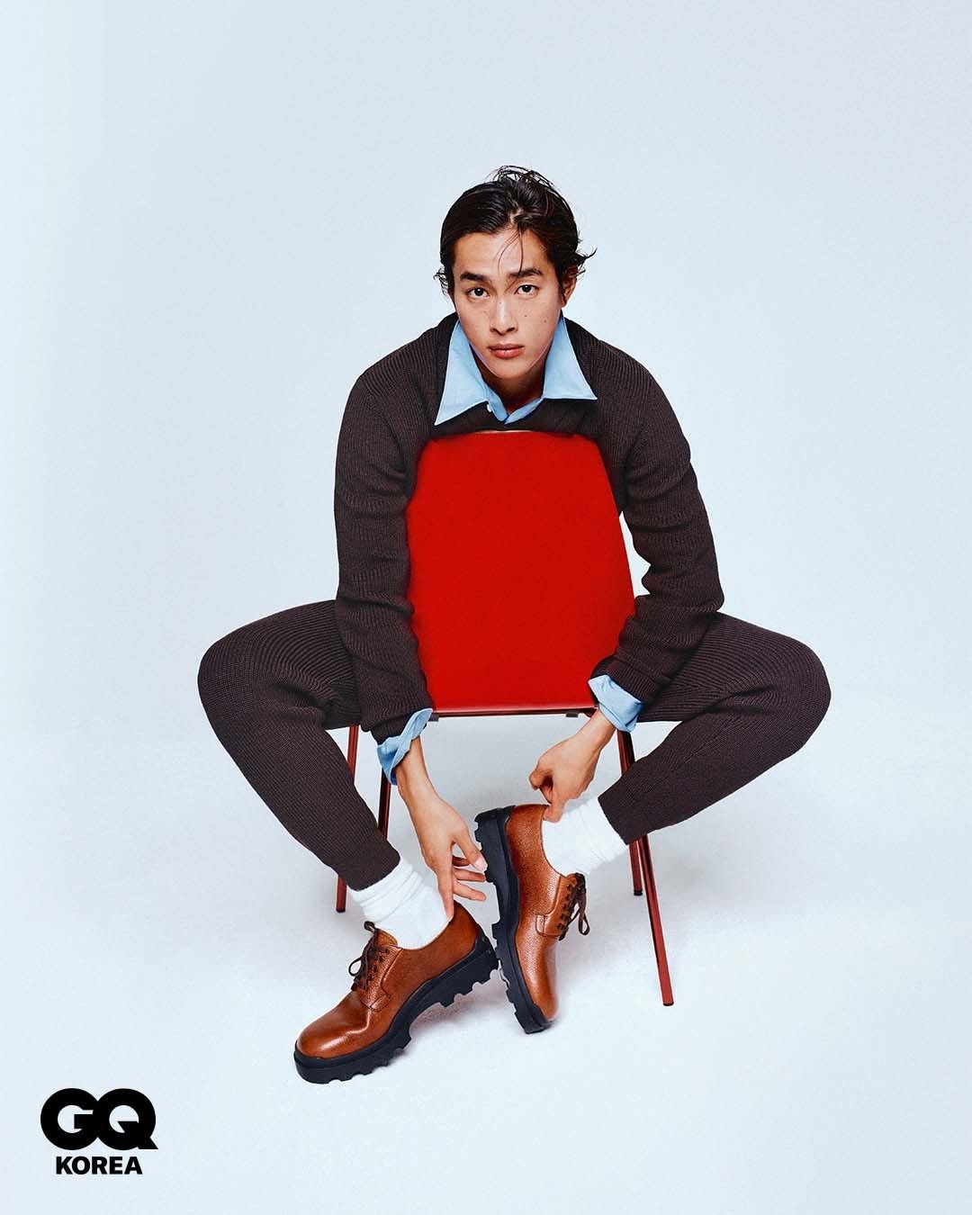 Photo shared by GQ KOREA on December 01, 2025 tagging @prada, and @300ver. May be an image of wingtip shoes, duffle coat, poster, bolo tie, blazer, bowtie, suit and text that says 'GQ KOREA'.