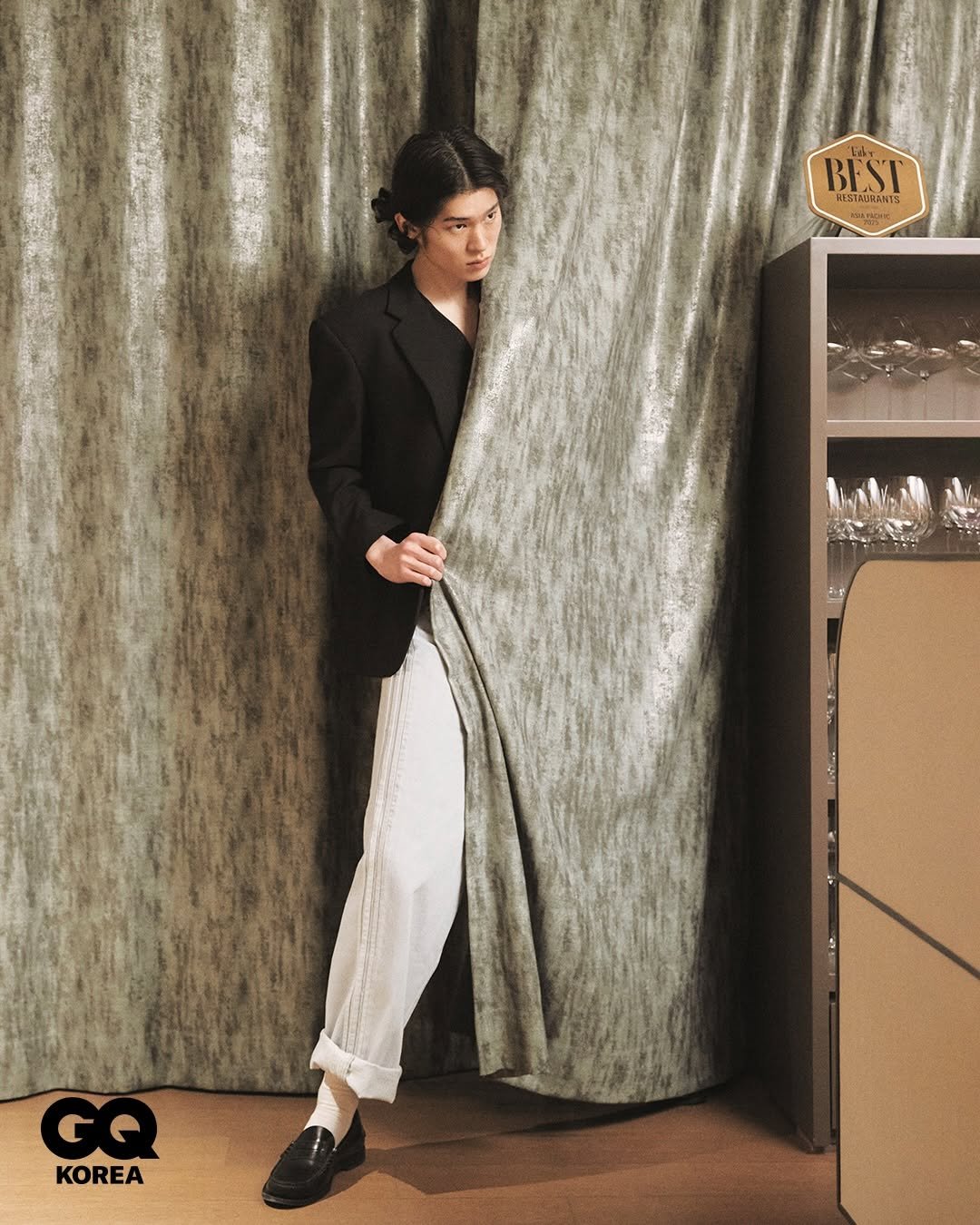 Photo by GQ KOREA on March 03, 2026. May be an image of suit, videogame controller, curtains, telephone and text that says 'BEST WISTAURANTS GQ G G KOREA'.