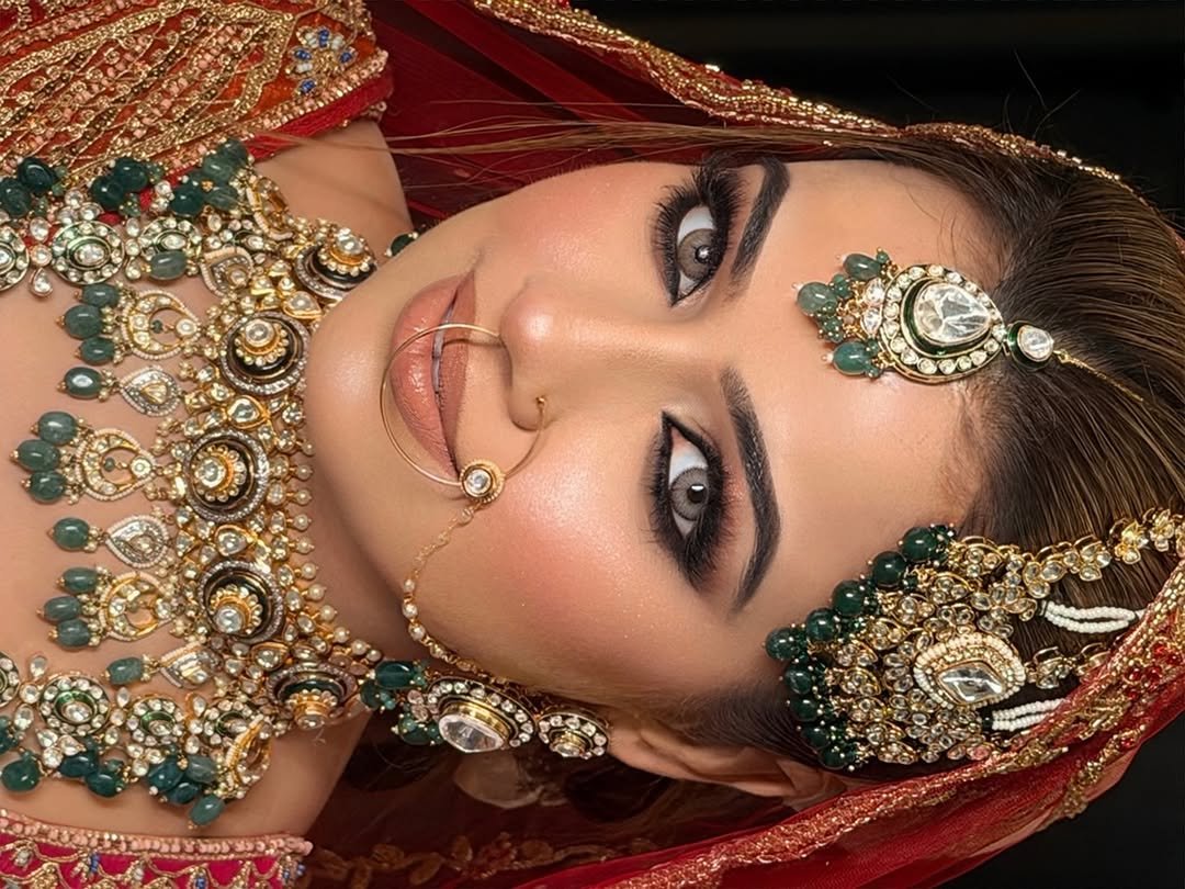 Photo shared by Guneet Virdi💄💋 on April 23, 2026 tagging @tanya_02897. May be an image of one or more people, henna, eyeliner, makeup, jewelry and text.