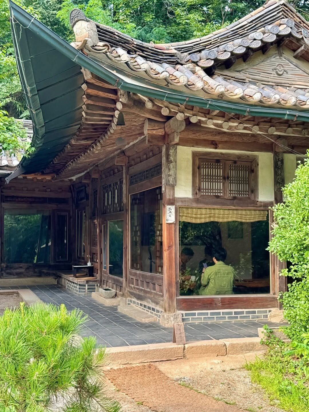 Photo by 경기관광공사 on August 15, 2025. May be an image of 2 people, temple and text.