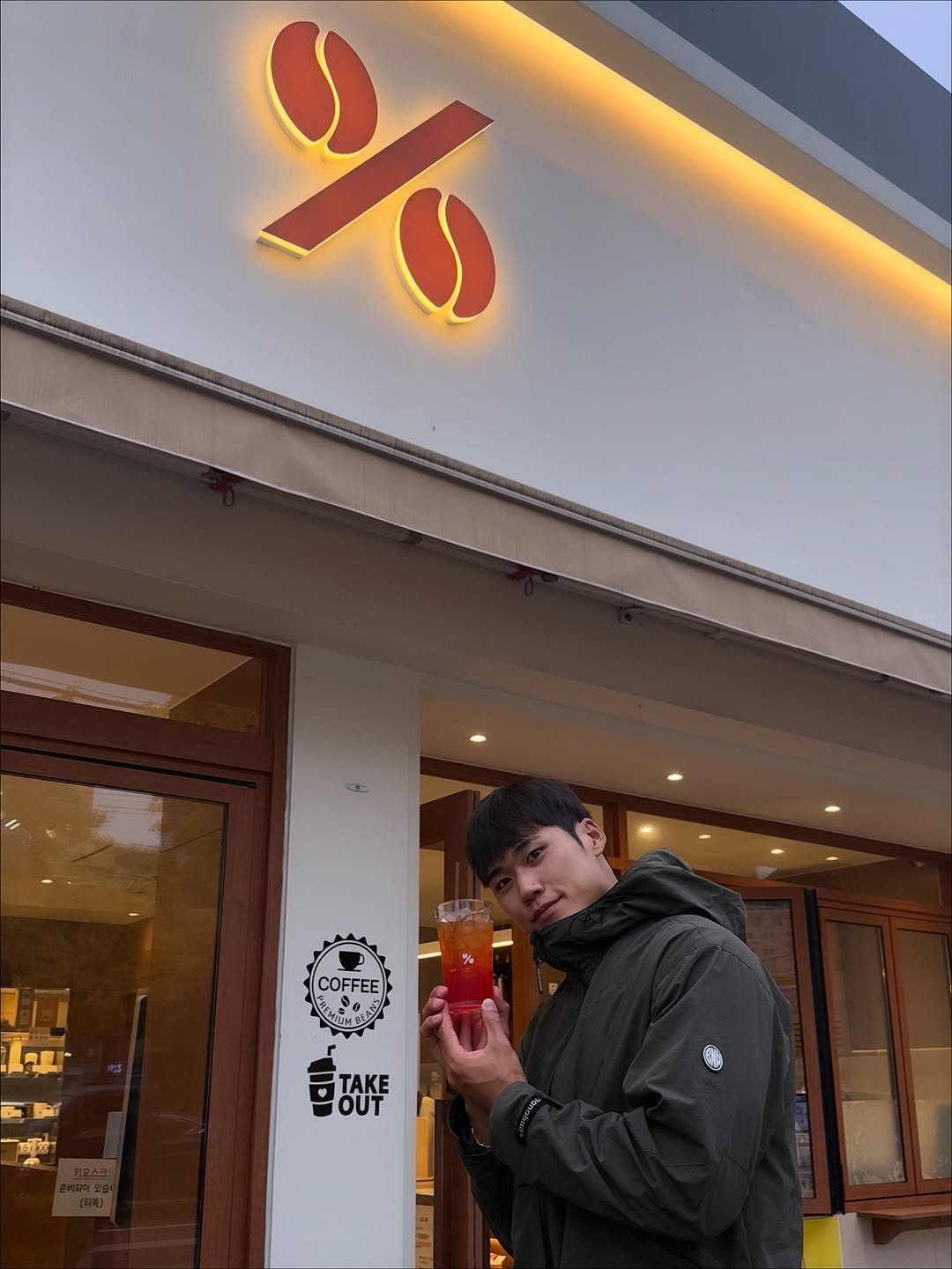 Photo shared by 이동규 on November 08, 2025 tagging @tenpercent.coffee. May be an image of duffle coat, skateboard, parka, signboard and text.