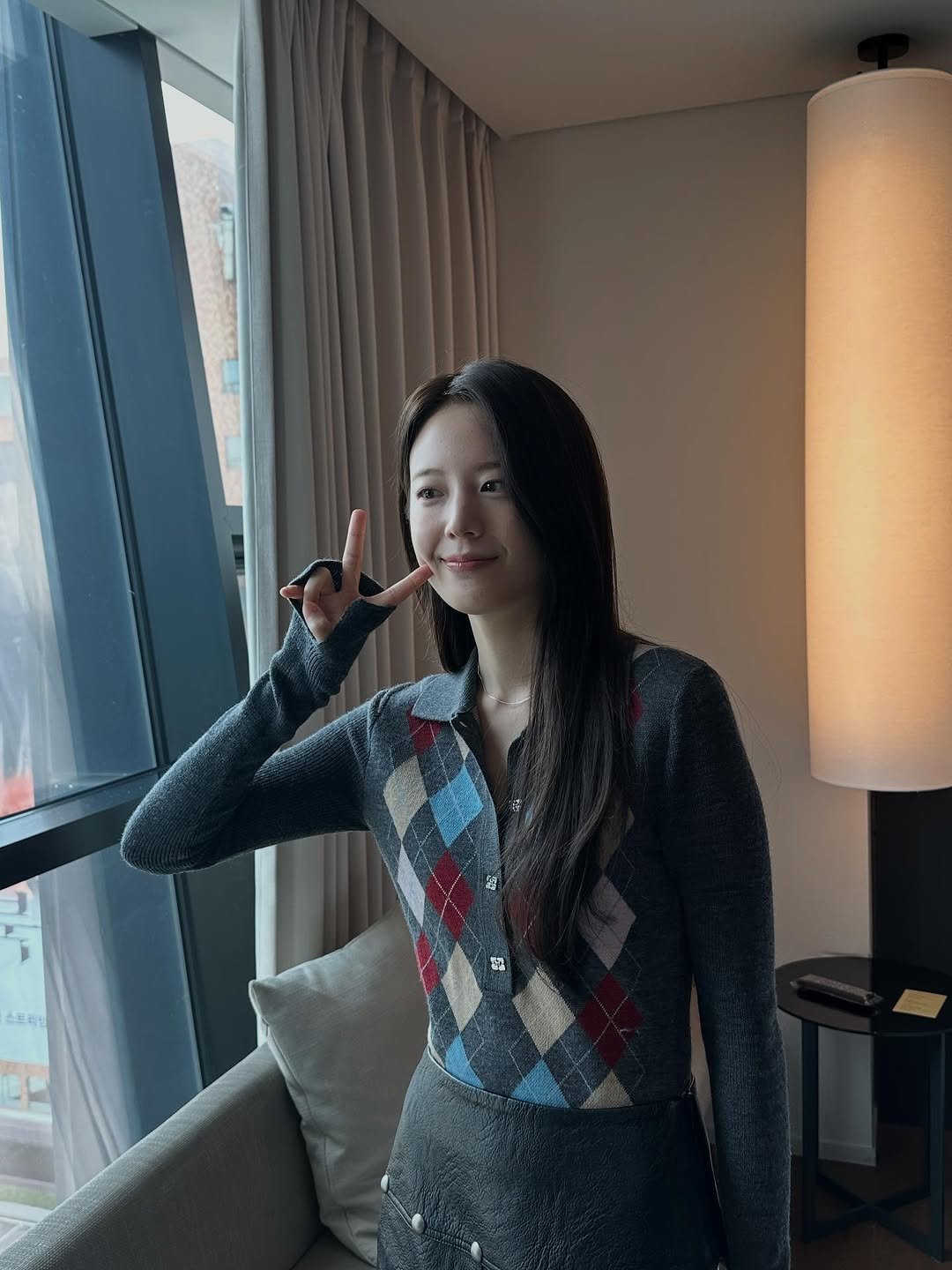 Photo by 장규리 on September 28, 2025. May be an image of 1 person, hair, turtleneck, suit and text.