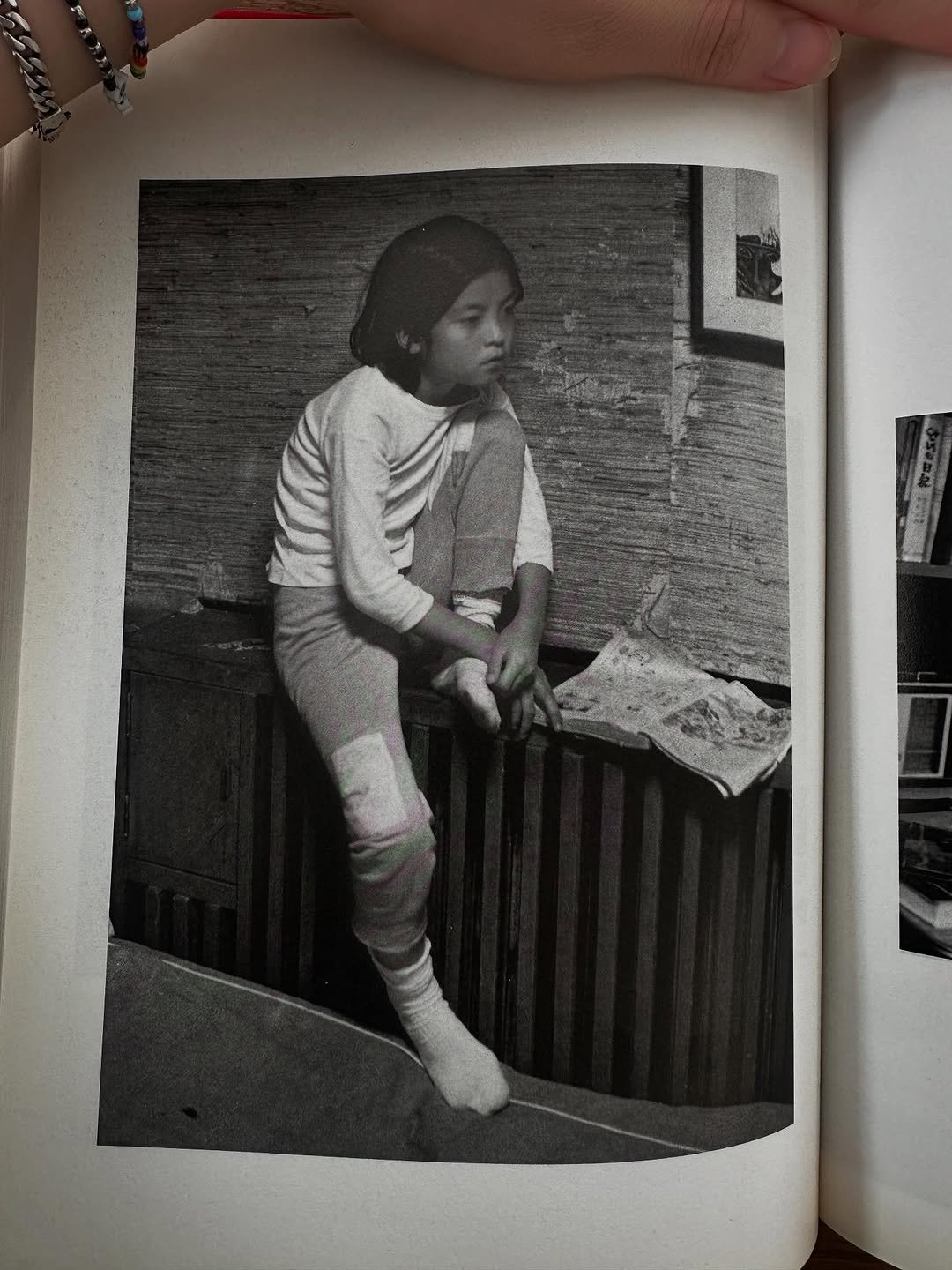Photo by 장규리 on July 20, 2025. May be a black-and-white image of child, book, newspaper and magazine.