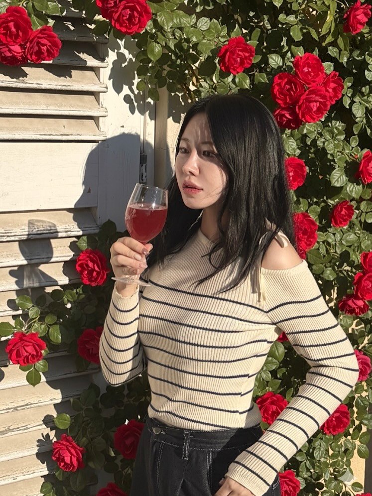 Photo by 흿 on October 08, 2025. May be an image of 1 person, drink, wine bottle, wine glass and text.
