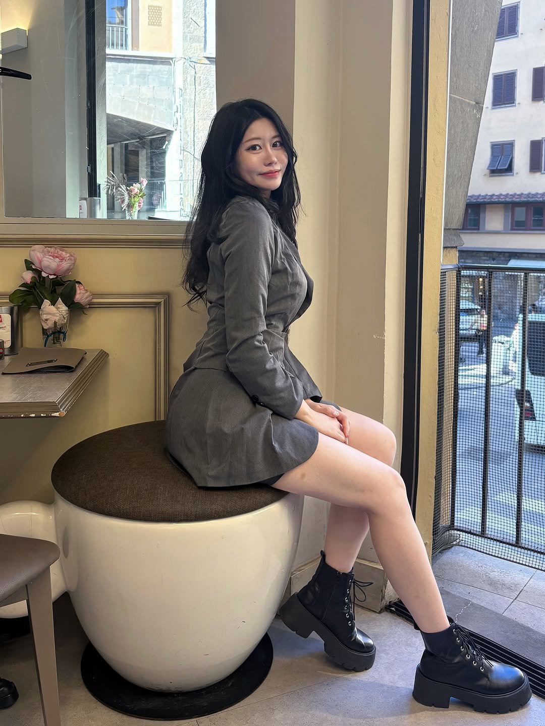 Photo shared by 흿 on October 10, 2025 tagging @moa__mood. May be an image of miniskirt, boots and text.