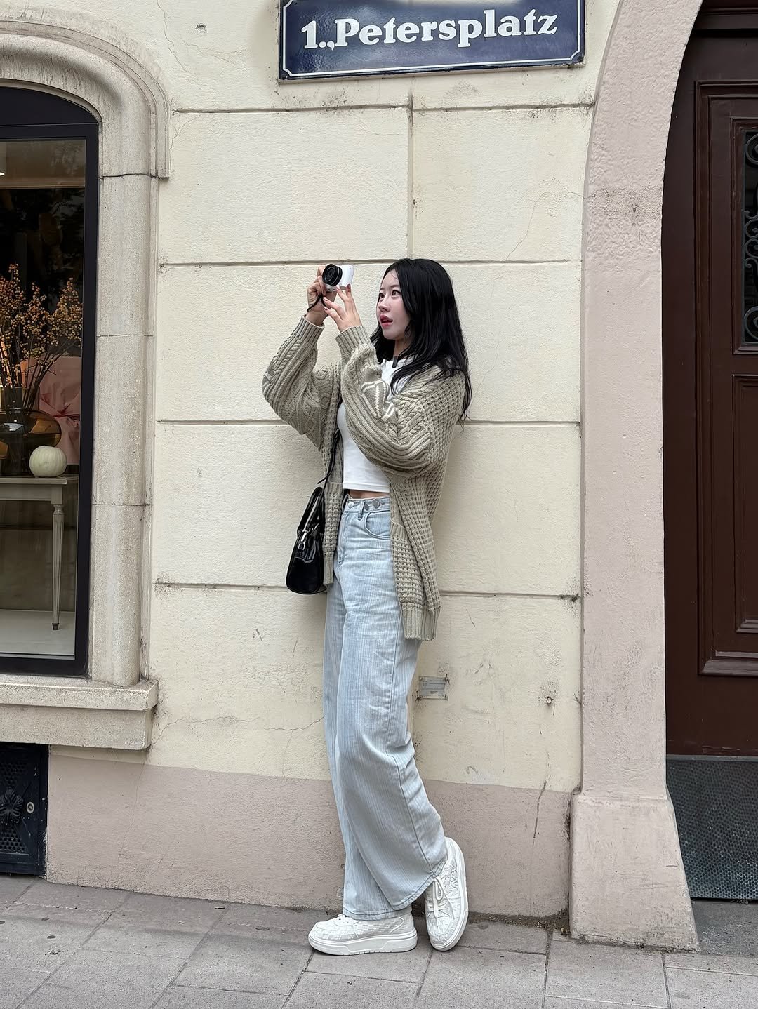 Photo shared by 흿 on November 03, 2025 tagging @shoopen_official, @mlbkorea, @musinsa_standard, and @zensai_kr. May be an image of overcoat, parka, street and text that says '1. ..Petersplatz'.