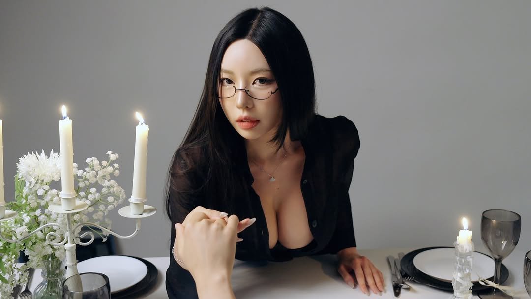 Photo by 동그란 Donggeuran ドングラン 圓圓 on August 22, 2025. May be an image of 1 person, candle holder, table, bra, candle and text.