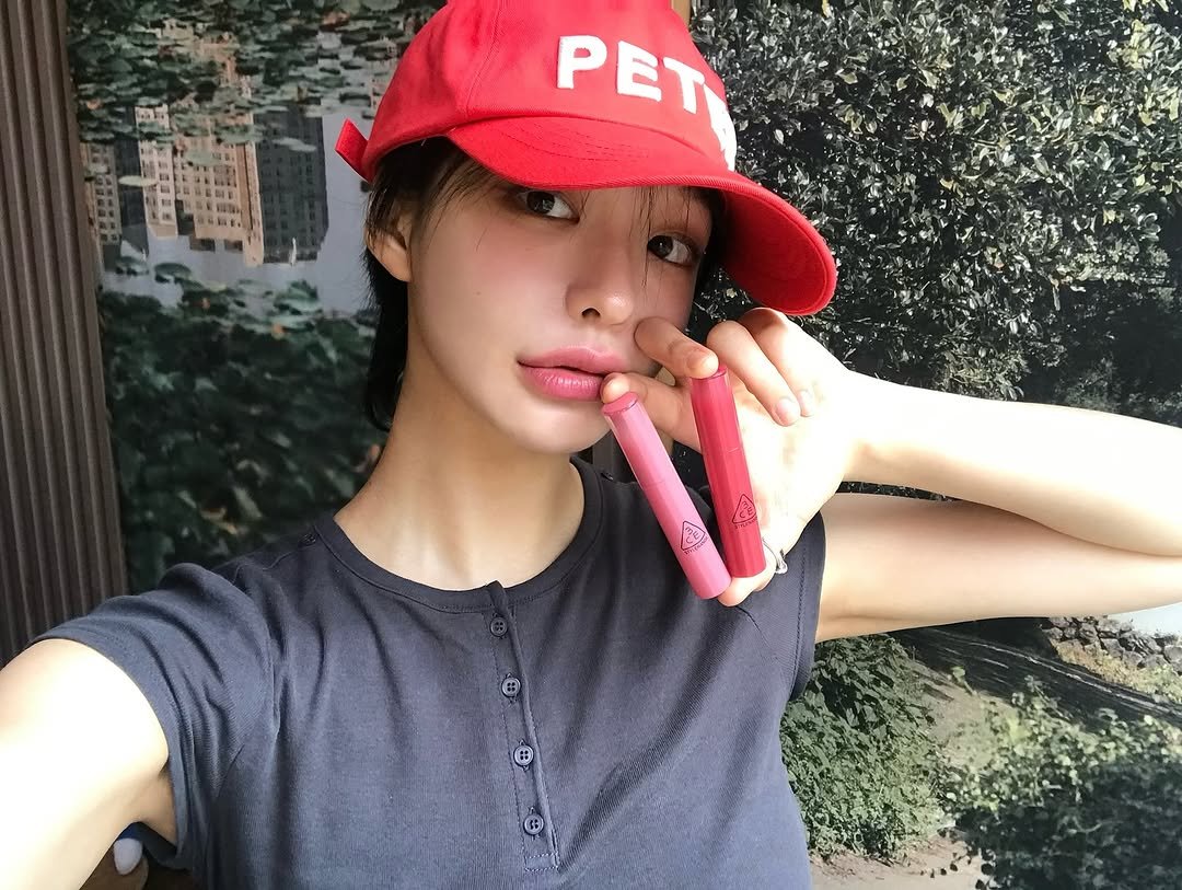 Photo shared by 하경 on July 10, 2025 tagging @3ce_official. May be an image of 1 person, hat and text.