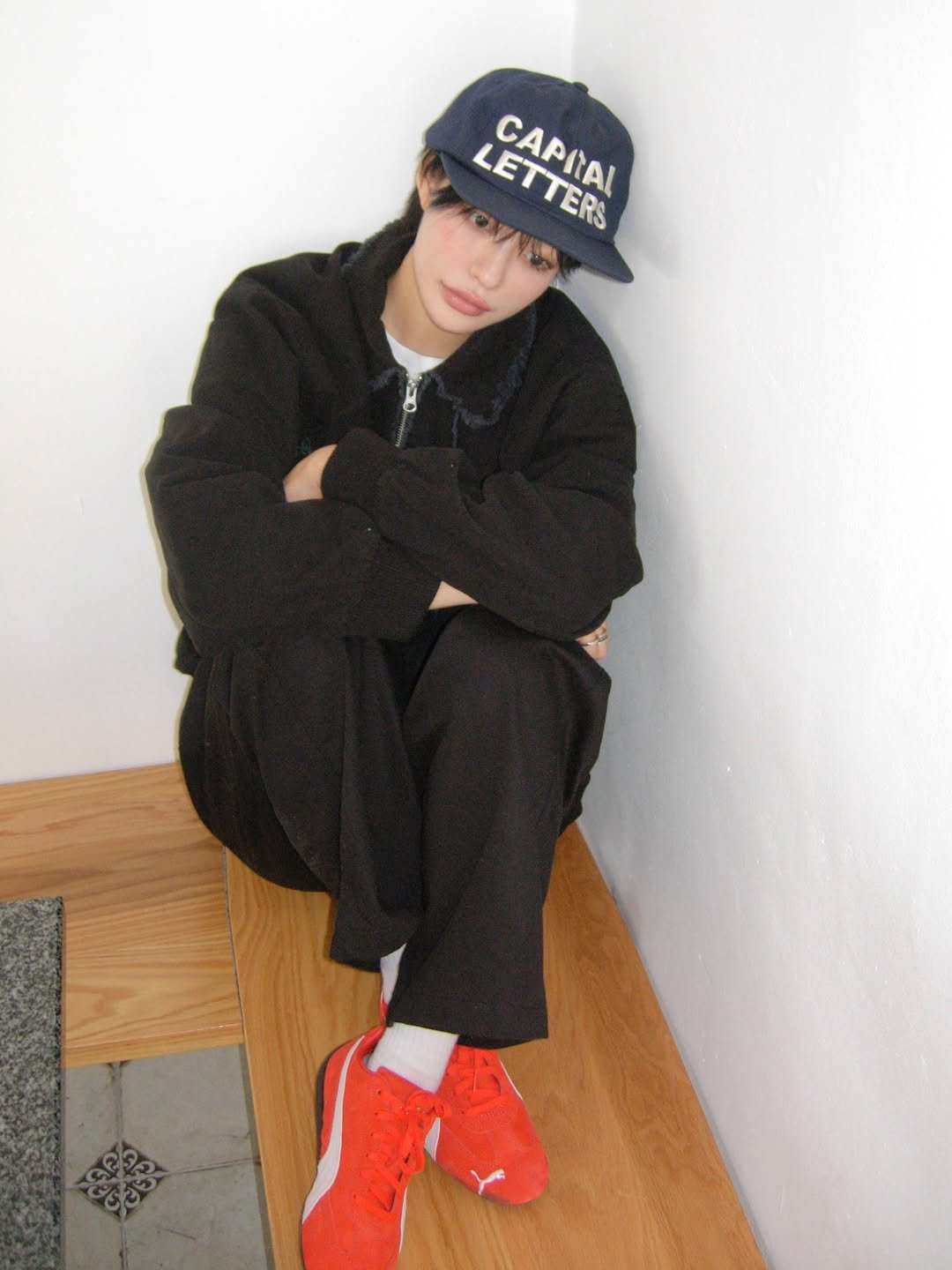Photo by 하경 on September 17, 2025. May be an image of 1 person, hat, sweatpants, sweatsuit, sportswear and text.