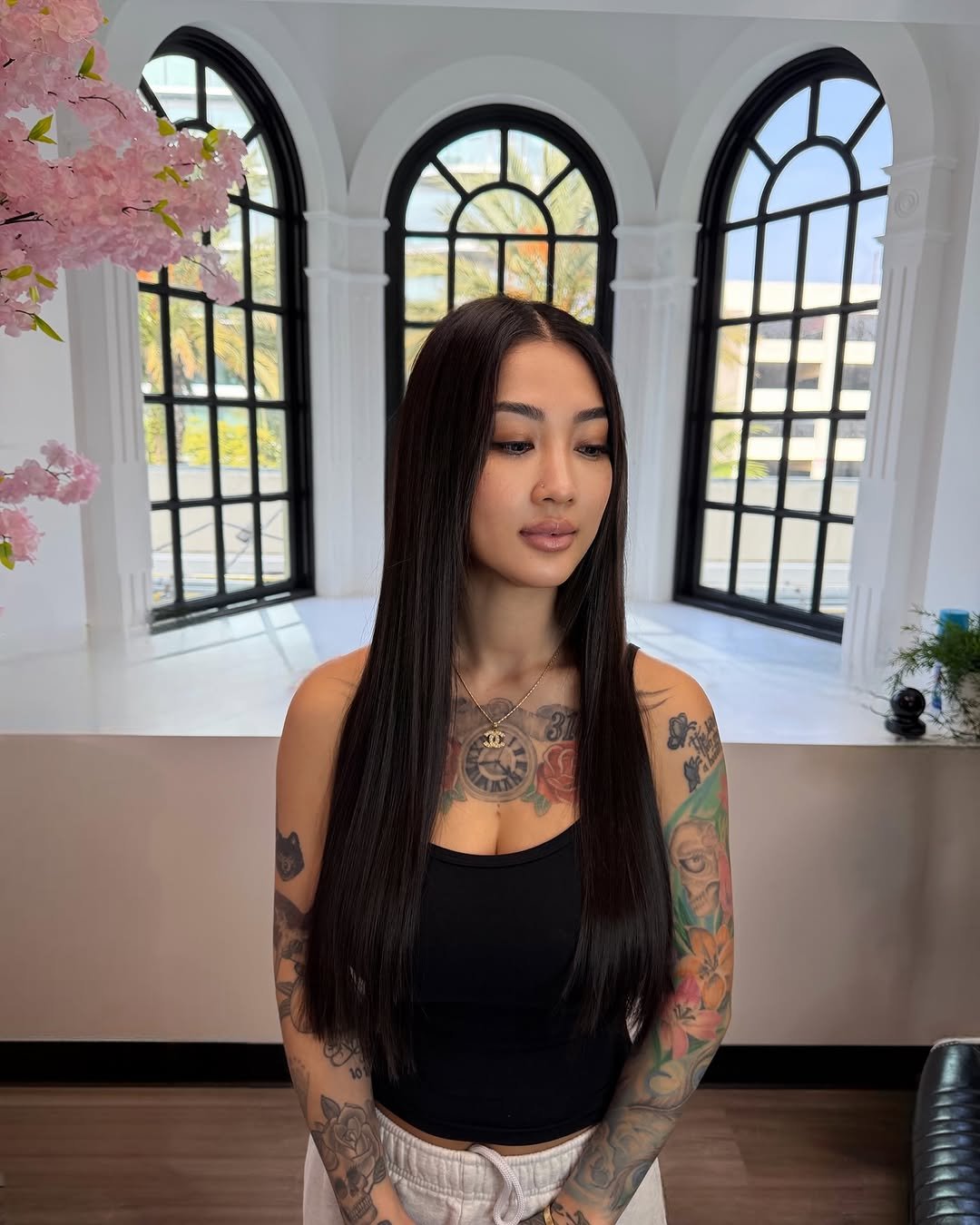 Photo by Hair extensions on October 26, 2025. May be an image of one or more people, long hair, tattoo, makeup and text.