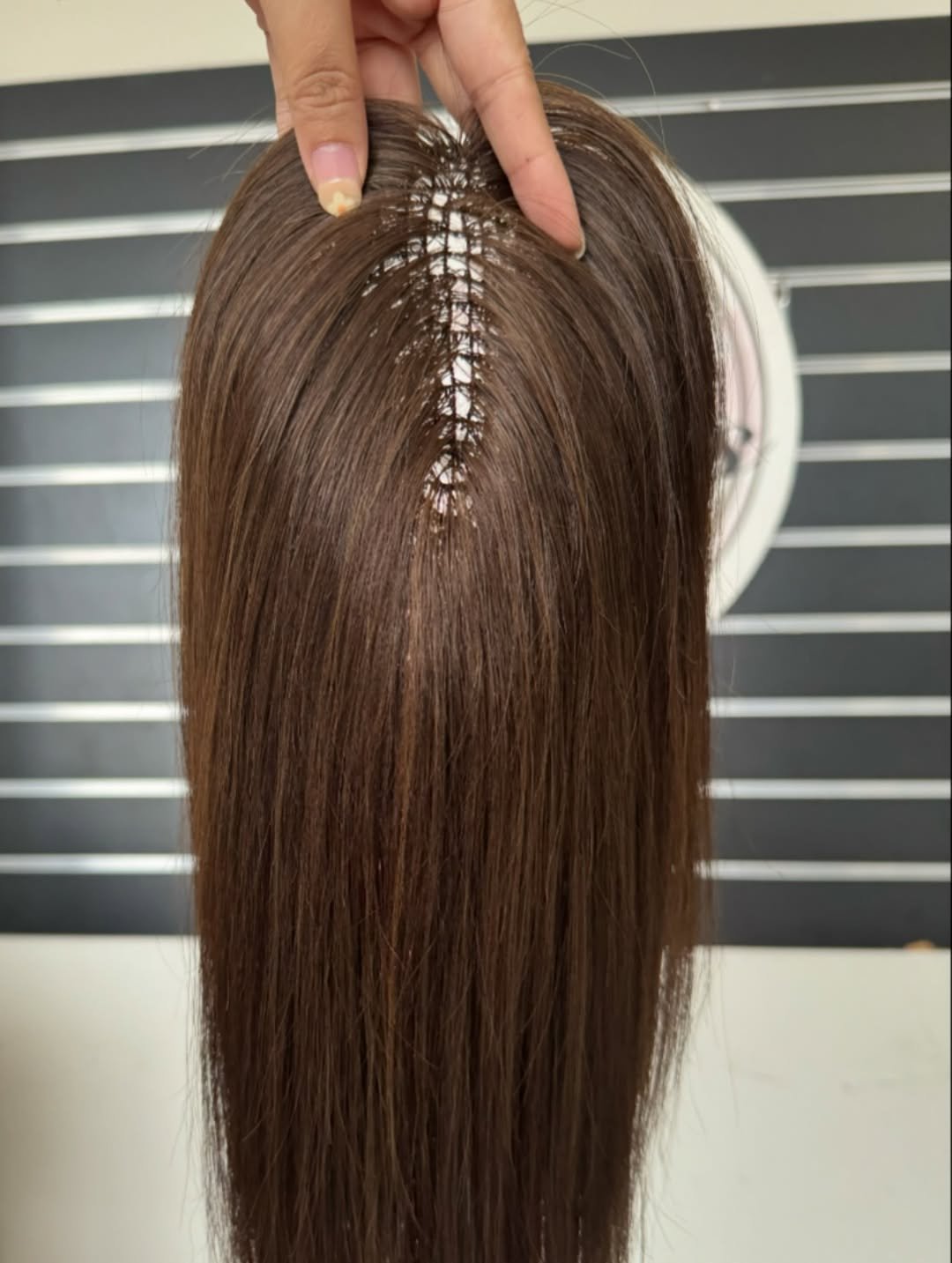 Photo by Alice Mao on December 02, 2025. May be an image of one or more people, long hair, mannequin and text.