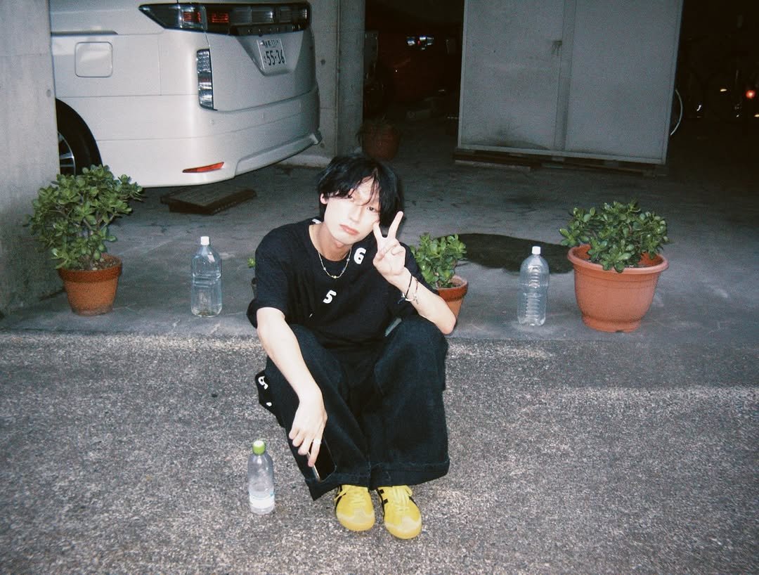 Photo by 승한•スンハン on August 09, 2025. May be an image of 1 person, bangs, cigarette, bolo tie and text.