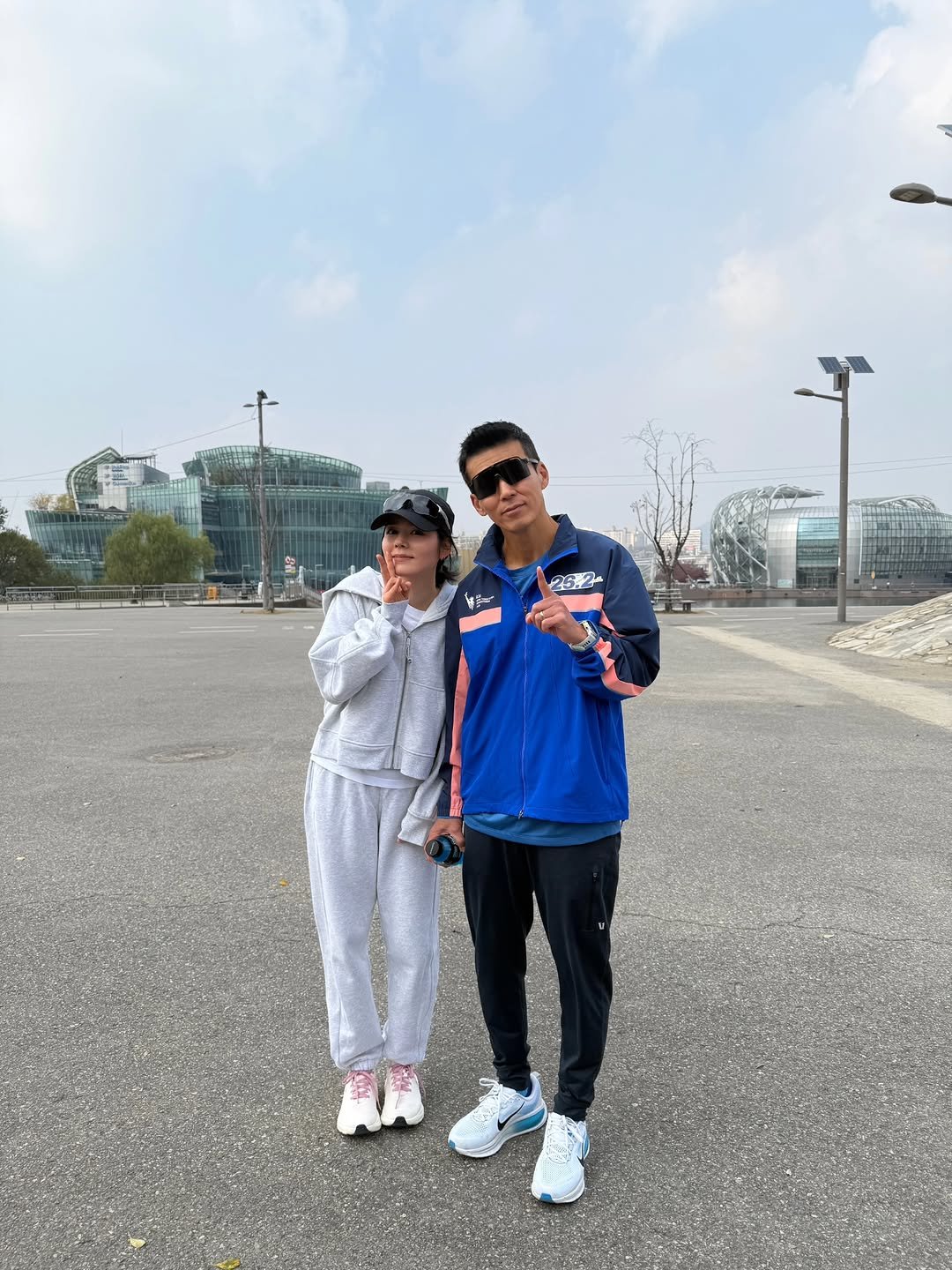 Photo by 한가인 on January 01, 2026. May be an image of one or more people, sweatpants, parka, sweatsuit, fog, stadium and text.