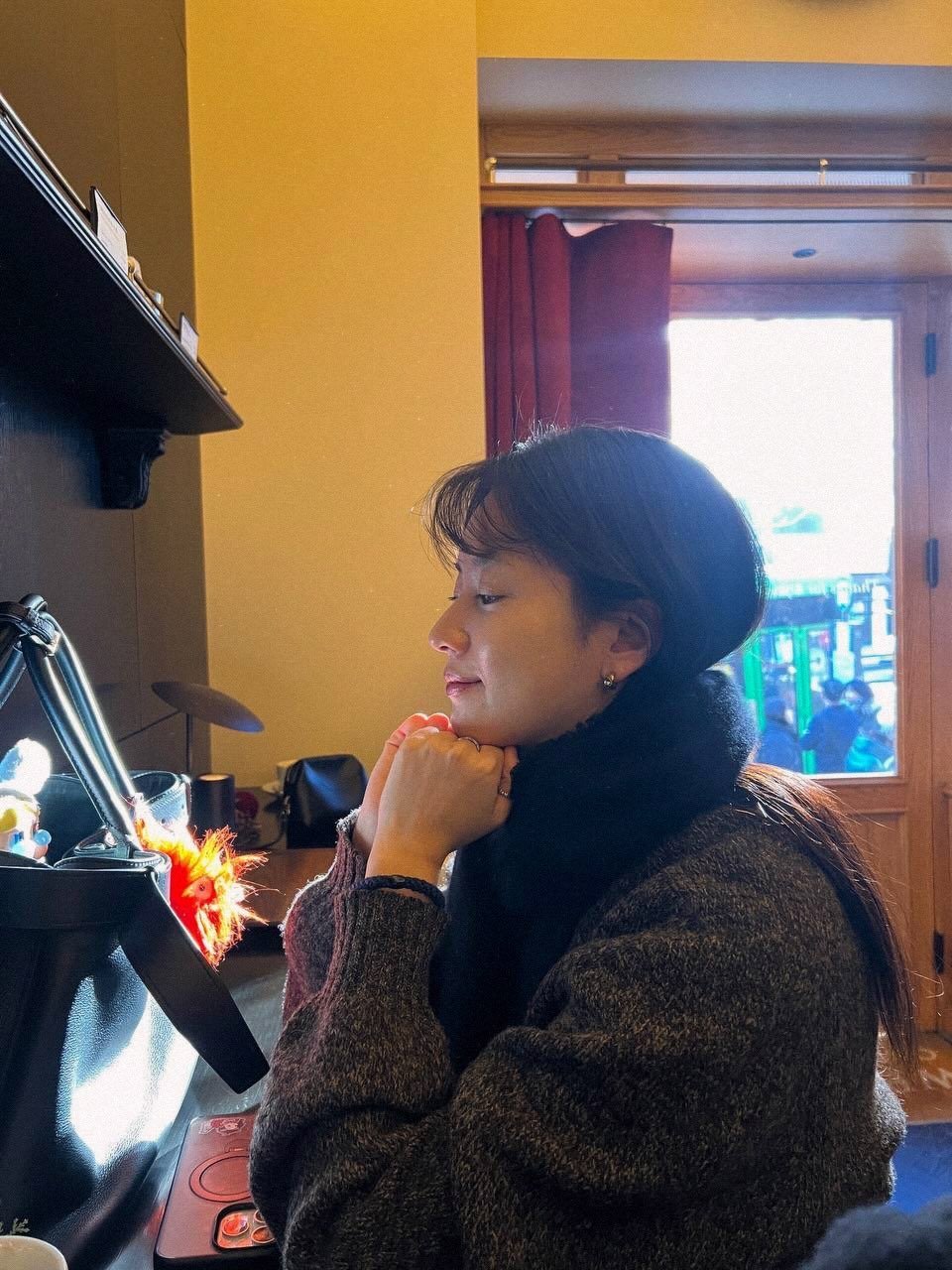 Photo by Hanhyojoo on February 08, 2026. May be an image of one or more people, hair, duffle coat, turtleneck, beret and text.