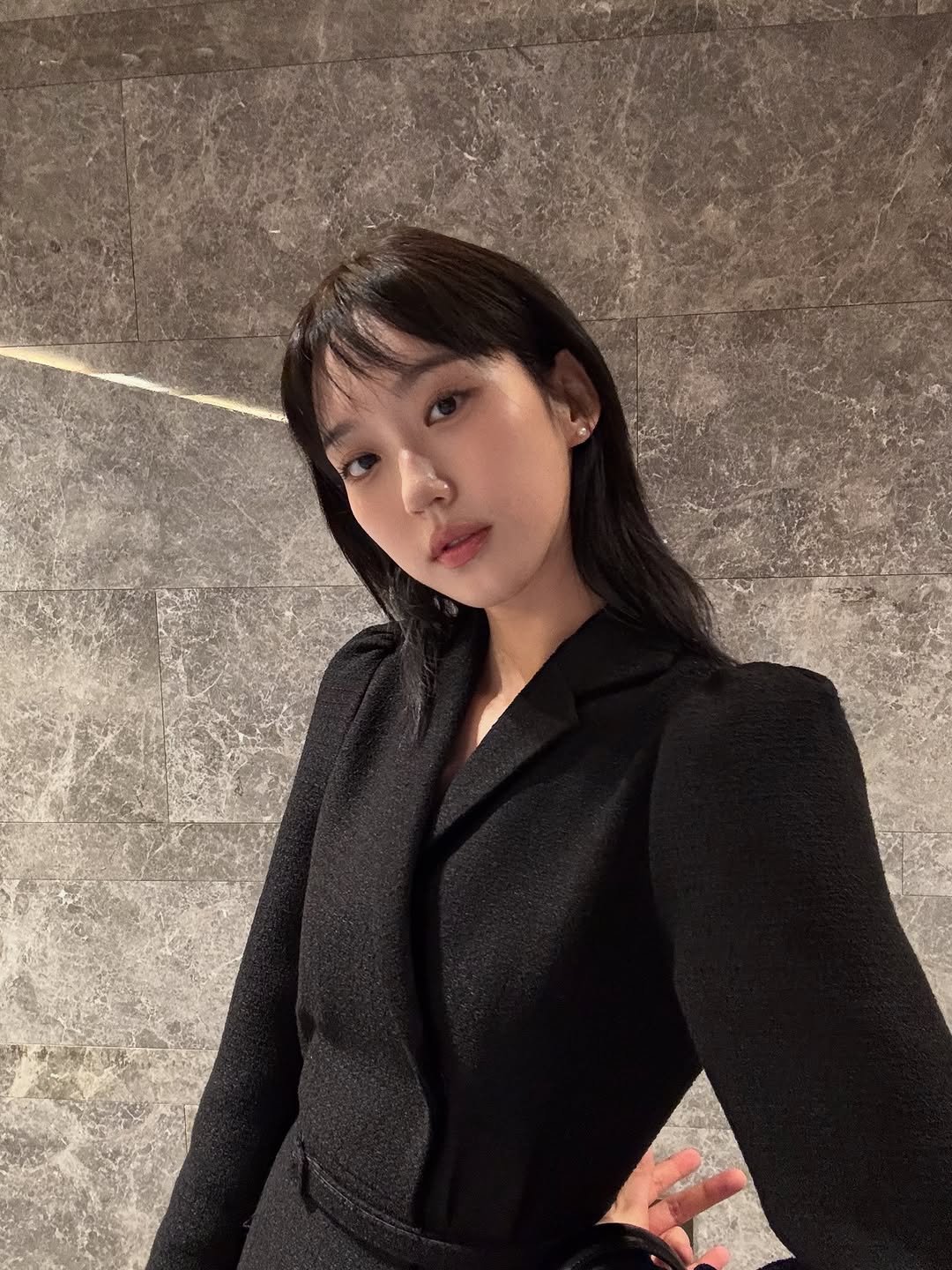 Photo by 한지현 on October 11, 2025. May be an image of one or more people, hair, top, blazer and text.