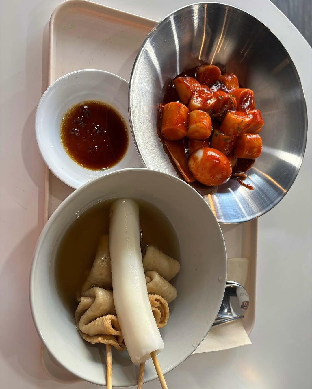 Photo by 토모떡볶이 on November 28, 2025. May be an image of tofu, ramen, noodles, skewer, chopsticks, sauce and text.