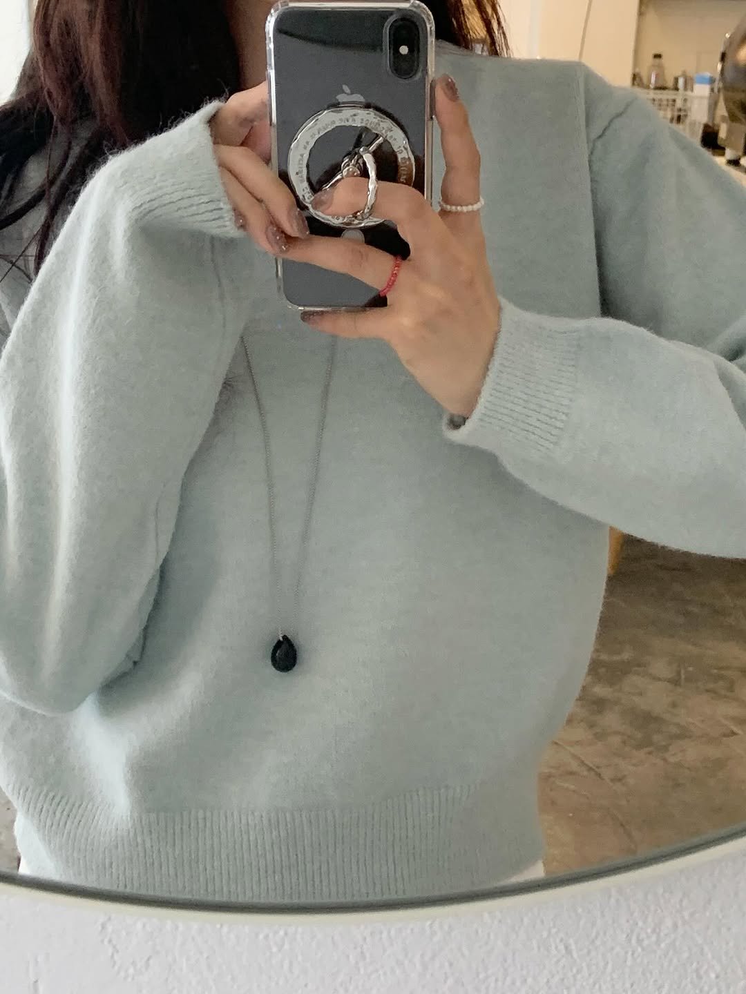 Photo shared by 수빈 on October 09, 2025 tagging @aviemuah. May be a selfie of 1 person, sweater, turtleneck, necklace, cardigan, mirror and text.