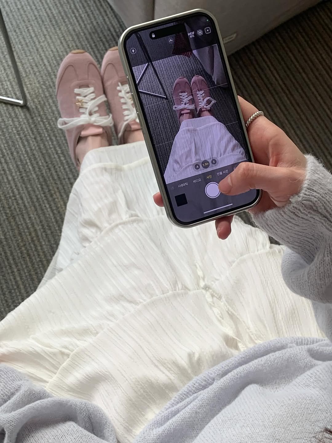 Photo by 수빈 on March 11, 2026. May be an image of phone, bath robe, sweatpants and text.