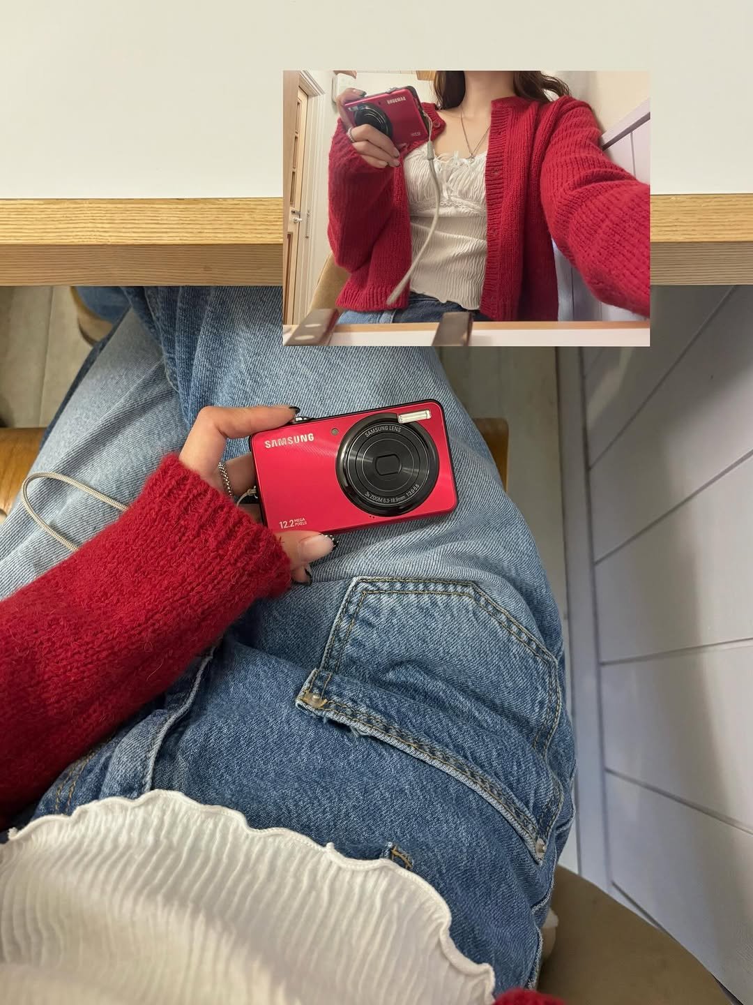 Photo by 수빈 on March 15, 2026. May be an image of sweater, clothes hanger, camera, cardigan and text.