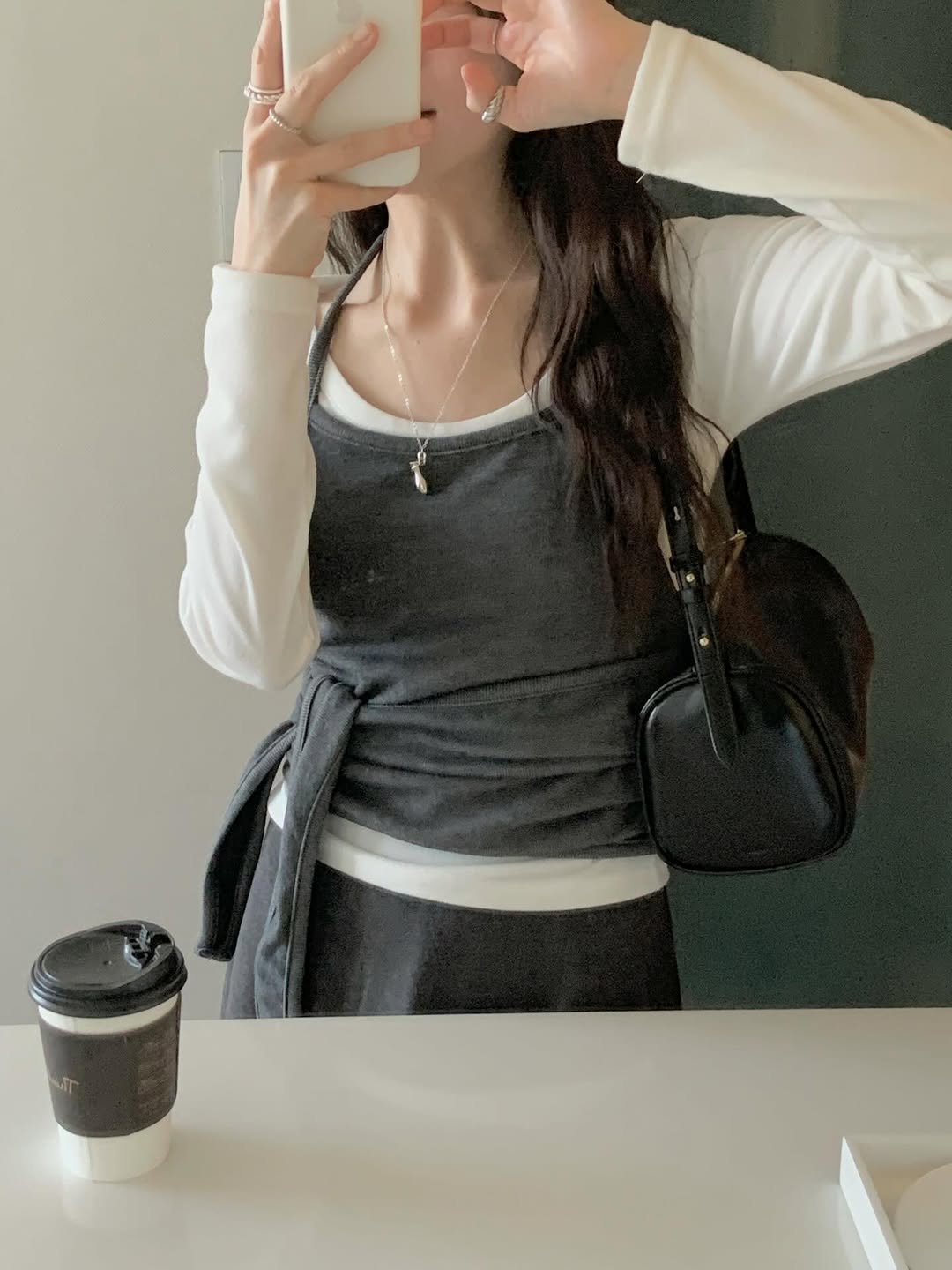 Photo shared by 수빈 on January 12, 2026 tagging @valluat_official. May be a selfie of one or more people, hair, phone, mirror, top, cornflower and text.