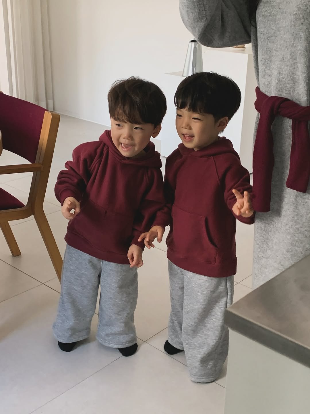 Photo by 💍 ＋👶🏻👶🏻 on December 01, 2025. May be an image of child, duffle coat, sweatpants and text.