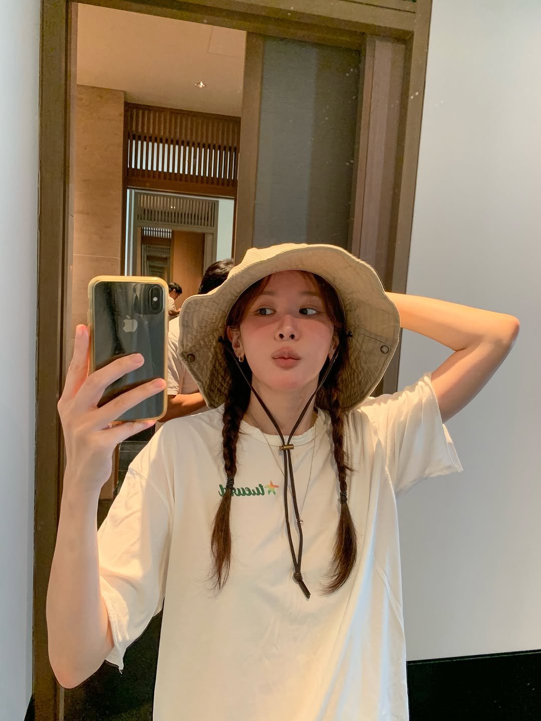 Photo by 해피림 메이크업 혜림쌤 on July 18, 2025. May be a selfie of 1 person, braids, hat, mirror and text.