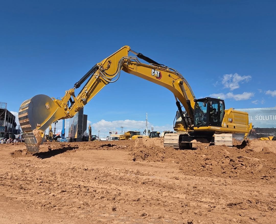 Photo by Josh on March 07, 2026. May be an image of scraper, crane, construction and text that says 'CAT SOLUTI('.