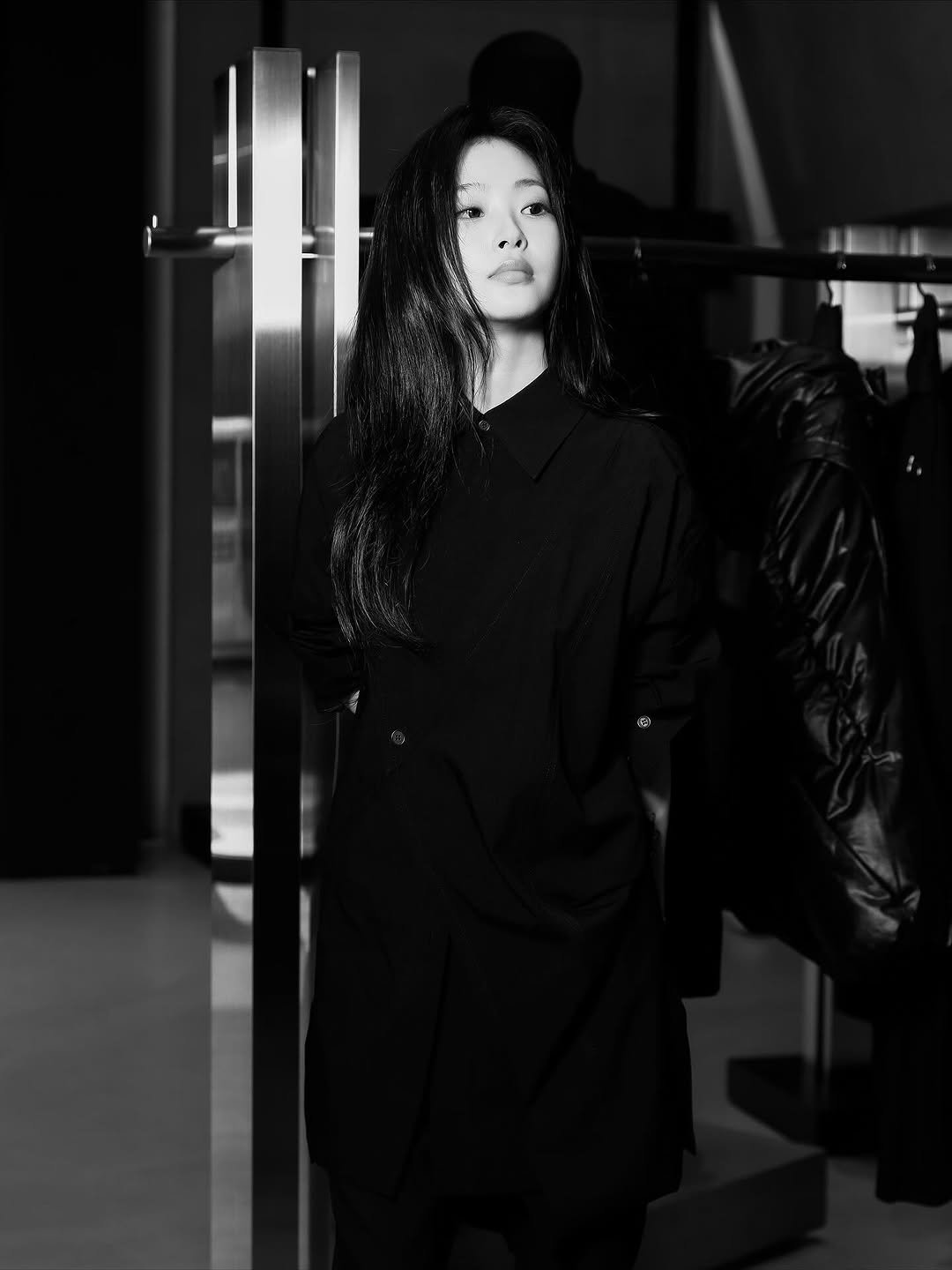 Photo shared by 최희진 on November 14, 2025 tagging @songzio_official. May be a black-and-white image of duffle coat, overcoat, hat, raincoat and text.