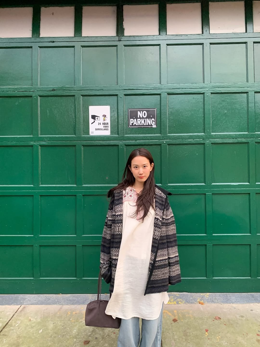 Photo by 장희령 on November 14, 2025. May be an image of overcoat, duffle coat, parka, turtleneck, door and text.