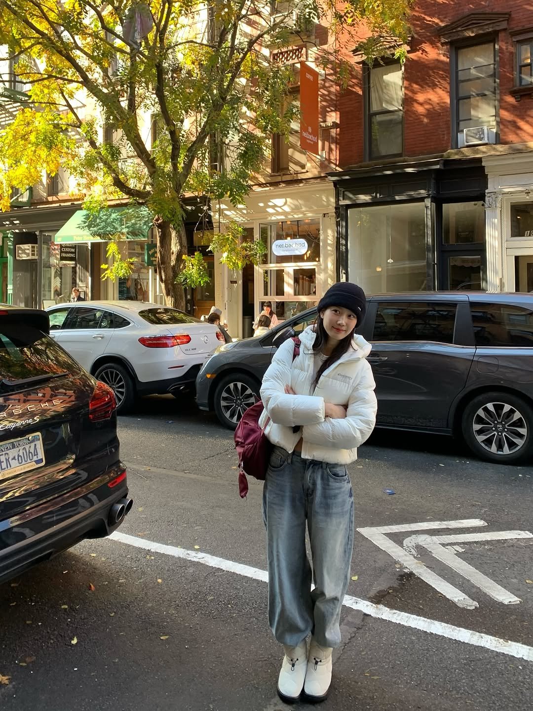 Photo shared by 장희령 on November 09, 2025 tagging @discoveryexpedition_kr. May be an image of duffle coat, overcoat, goosedown coat, parka, street and text.