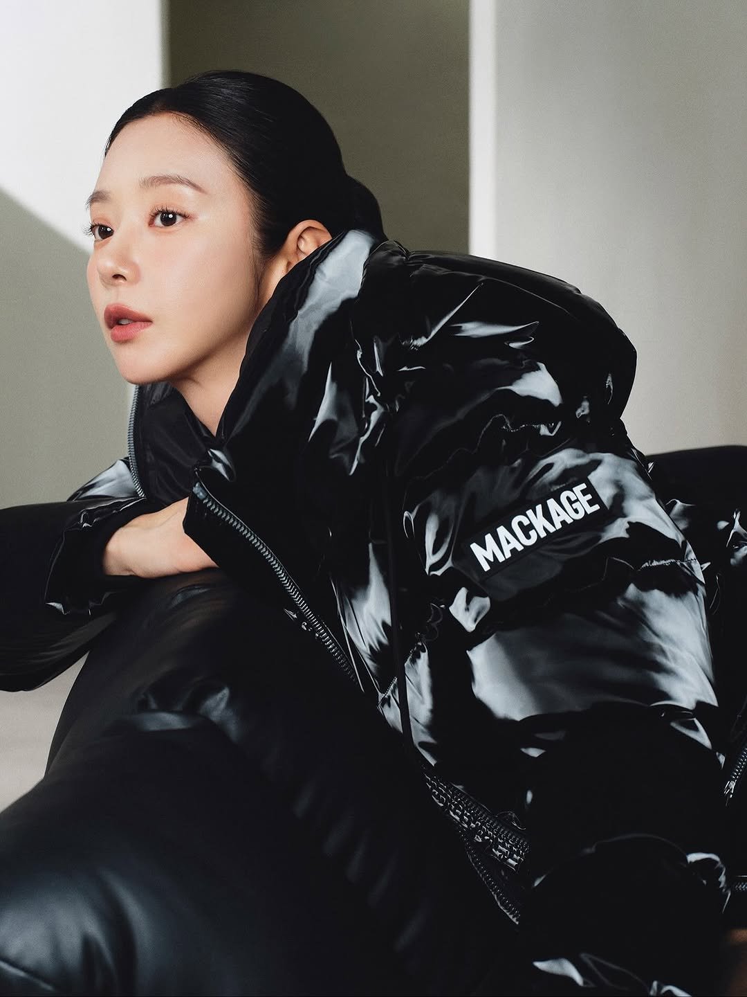 Photo shared by 이주빈 on November 10, 2025 tagging @mackage. May be an image of leather, goosedown coat, jacket, parka and text.