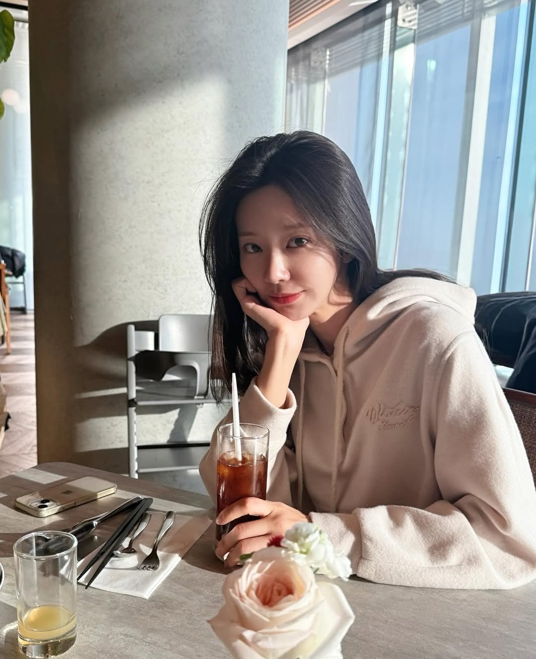 Photo shared by 이주빈 on December 11, 2025 tagging @sisleyfashion_kr. May be an image of one or more people, hair, cornflower, rose and text.