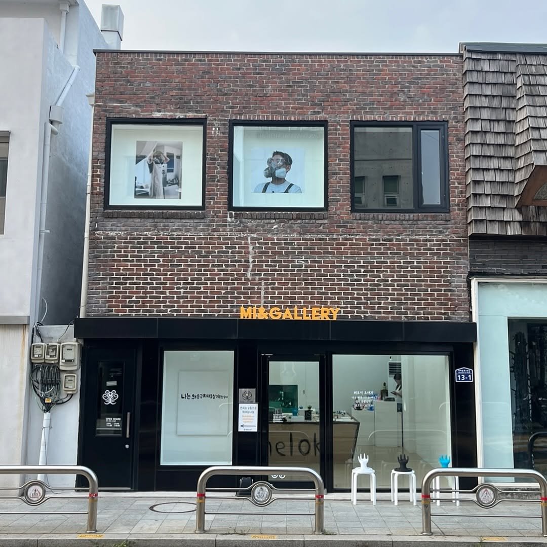 Photo shared by heloki 헤로키 on July 07, 2025 tagging @miandgallery. May be an image of 1 person, sparrow, signboard, display case, cornflower and text.