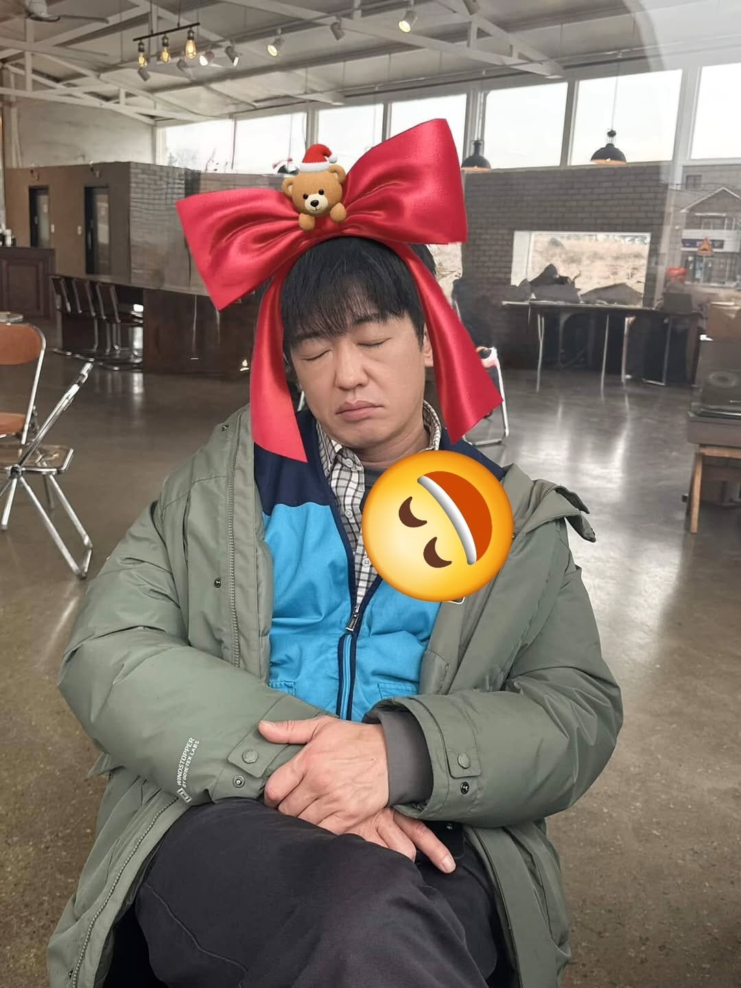 Photo by heosungtae on December 23, 2025. May be an image of one or more people, duffle coat, parka, costume and text.