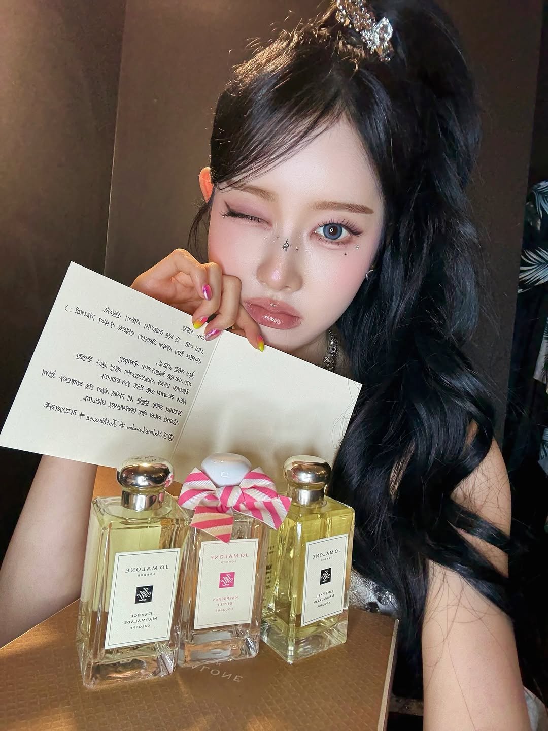 Photo by 시은 on July 12, 2025. May be an image of 1 person, fragrance, perfume and text.