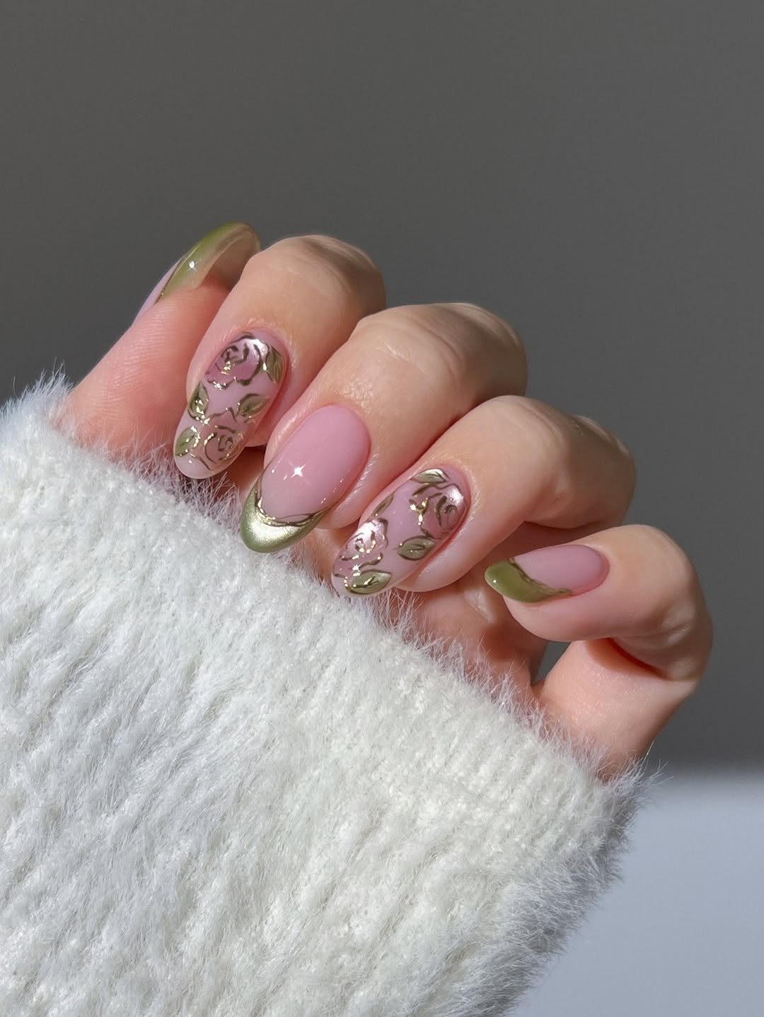 Pastel pink glass nails, rose nails, flower nails, sage green glass nails, silky cat eye nails, gold nails, french tip nails, pink nude nails, almond nails, spring nails, gradient green gem ring, dainty gold eternity ring, purple glassy nails, lavender lilac nails, purple chrome floral nails, textured nails, gold open amethyst ring, open leaf ring with diamonds, pastel aura nails, yellow purple blue pink peach pastels, 3D nail art, polka dot nails, candy nails, gold dotted ring,