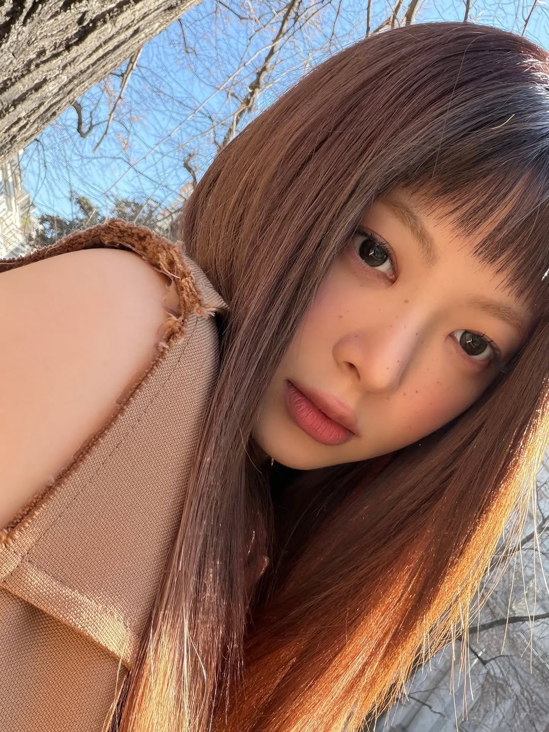 Photo by HONG EUNCHAE on March 15, 2026. May be a selfie of one or more people, makeup, hair, parka, turtleneck, outdoors and text.