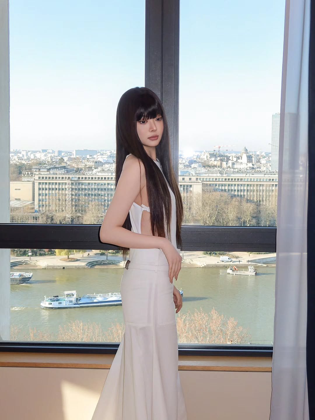 Photo shared by HONG EUNCHAE on March 04, 2026 tagging @courreges. May be an image of one or more people, hair, dress and text.