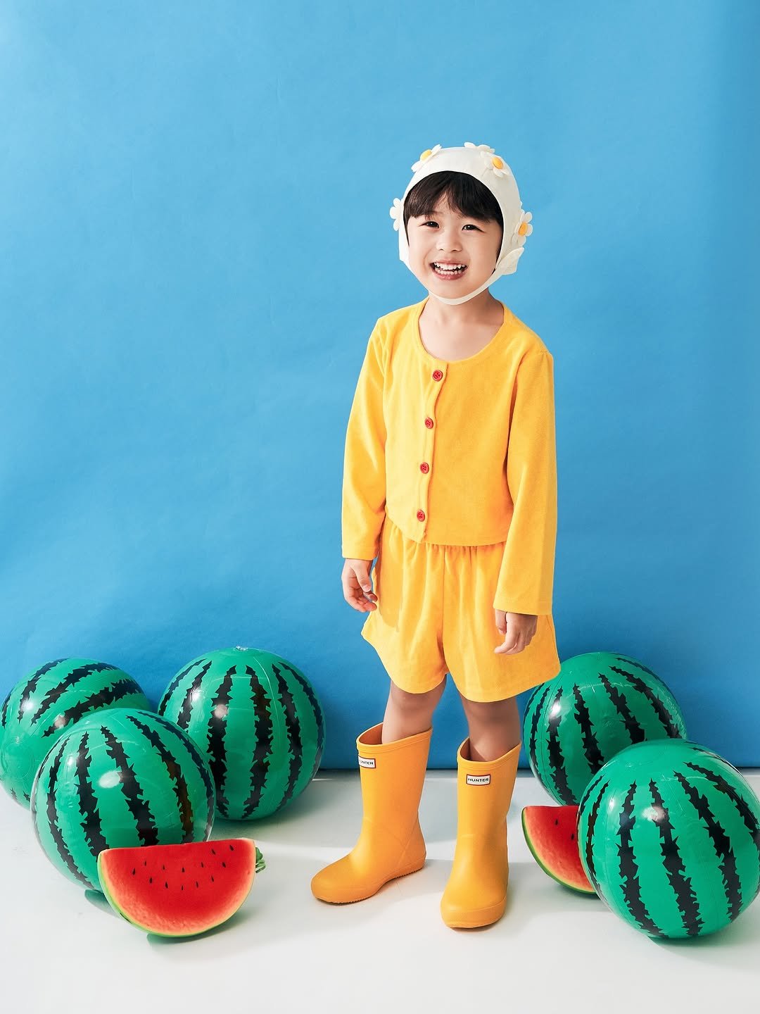Photo shared by 키즈모델 하론, 하론맘 새롬 on August 07, 2025 tagging @photosleek.studio. May be an image of 1 person, baby, watermelon, sleepwear, baby shoes, melon, boots and text.