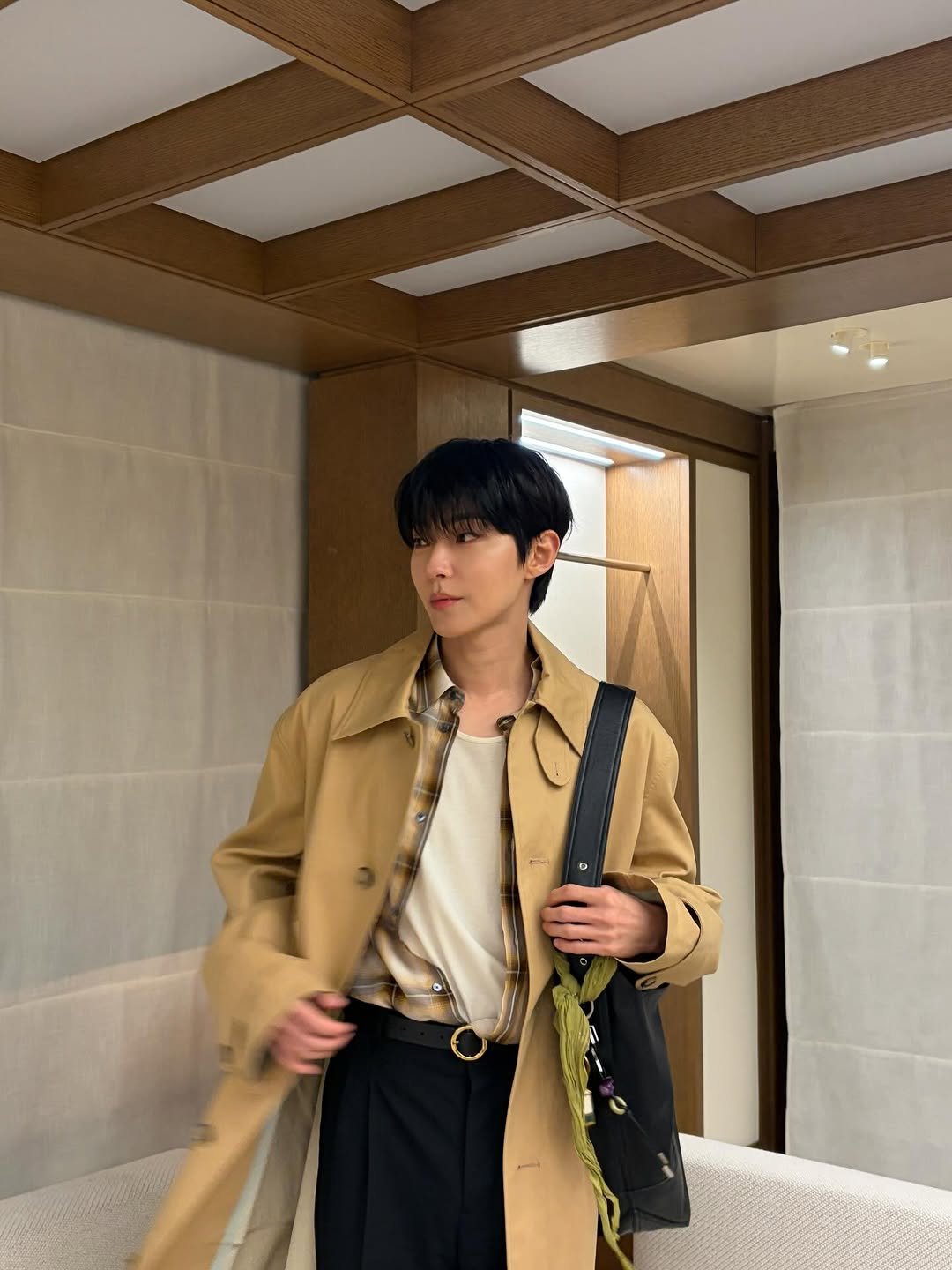 Photo shared by 황인엽 on April 09, 2026 tagging @amiparis. May be an image of duffle coat, overcoat and text.