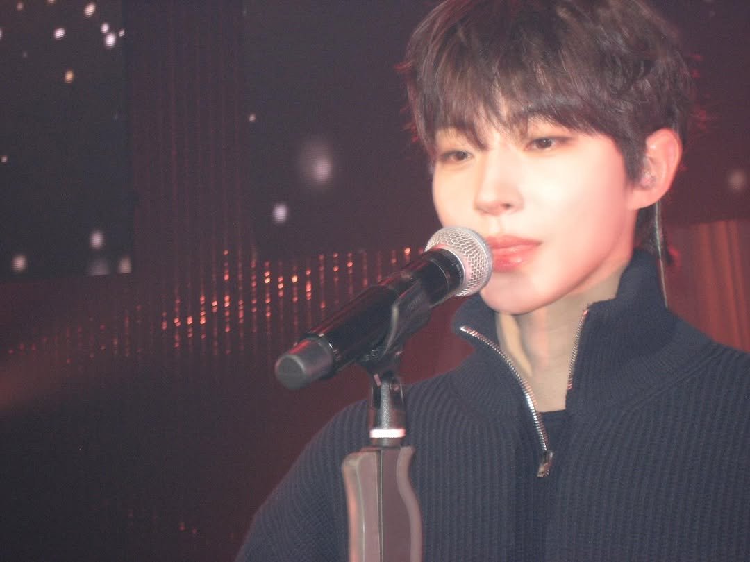 Photo shared by 황인엽 on February 22, 2026 tagging @g__medal. May be an image of one or more people, bangs, bolo tie, concert and text.